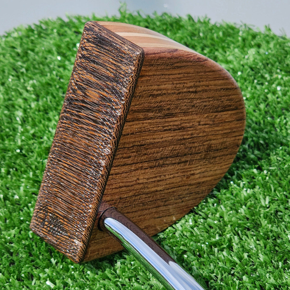 Exotic hardwood putter face close-up showing tight grain on a TimberTouch wood putter