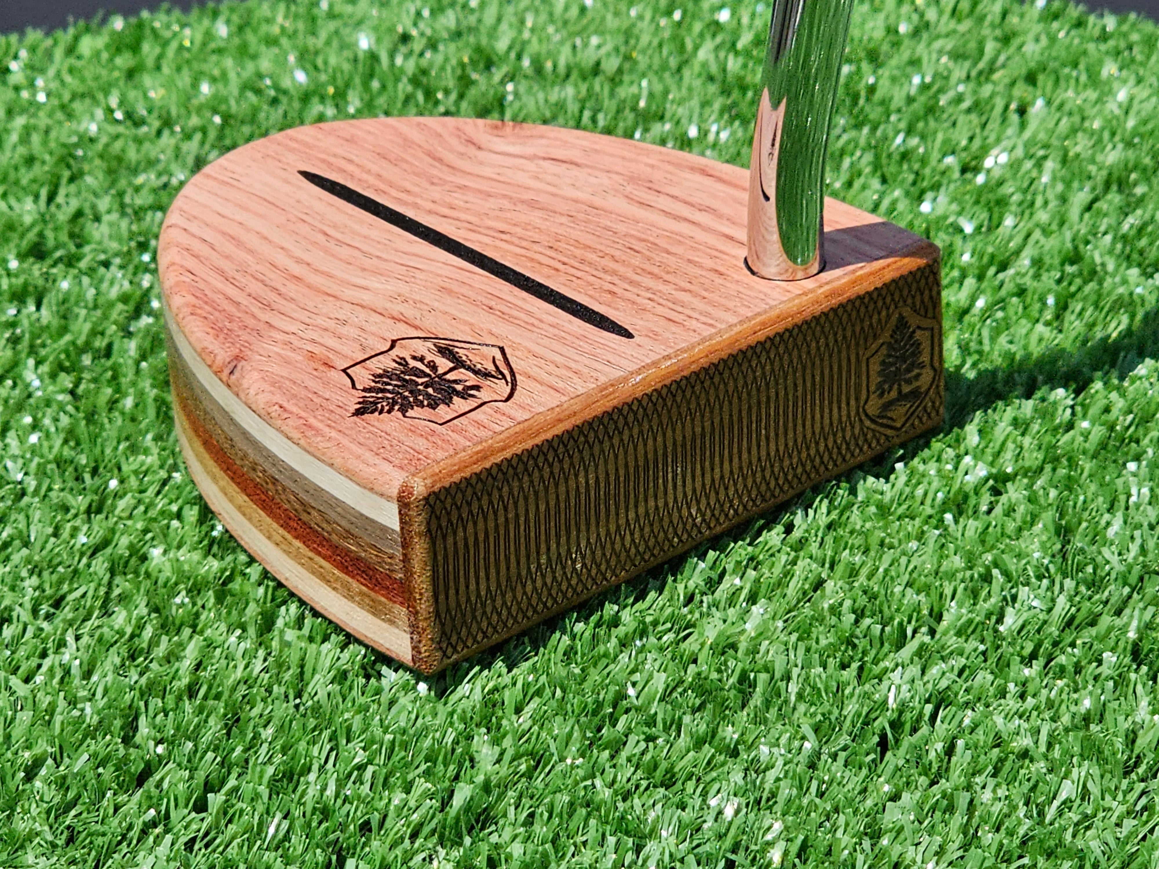 Golfer going through a pre-putt routine on the green