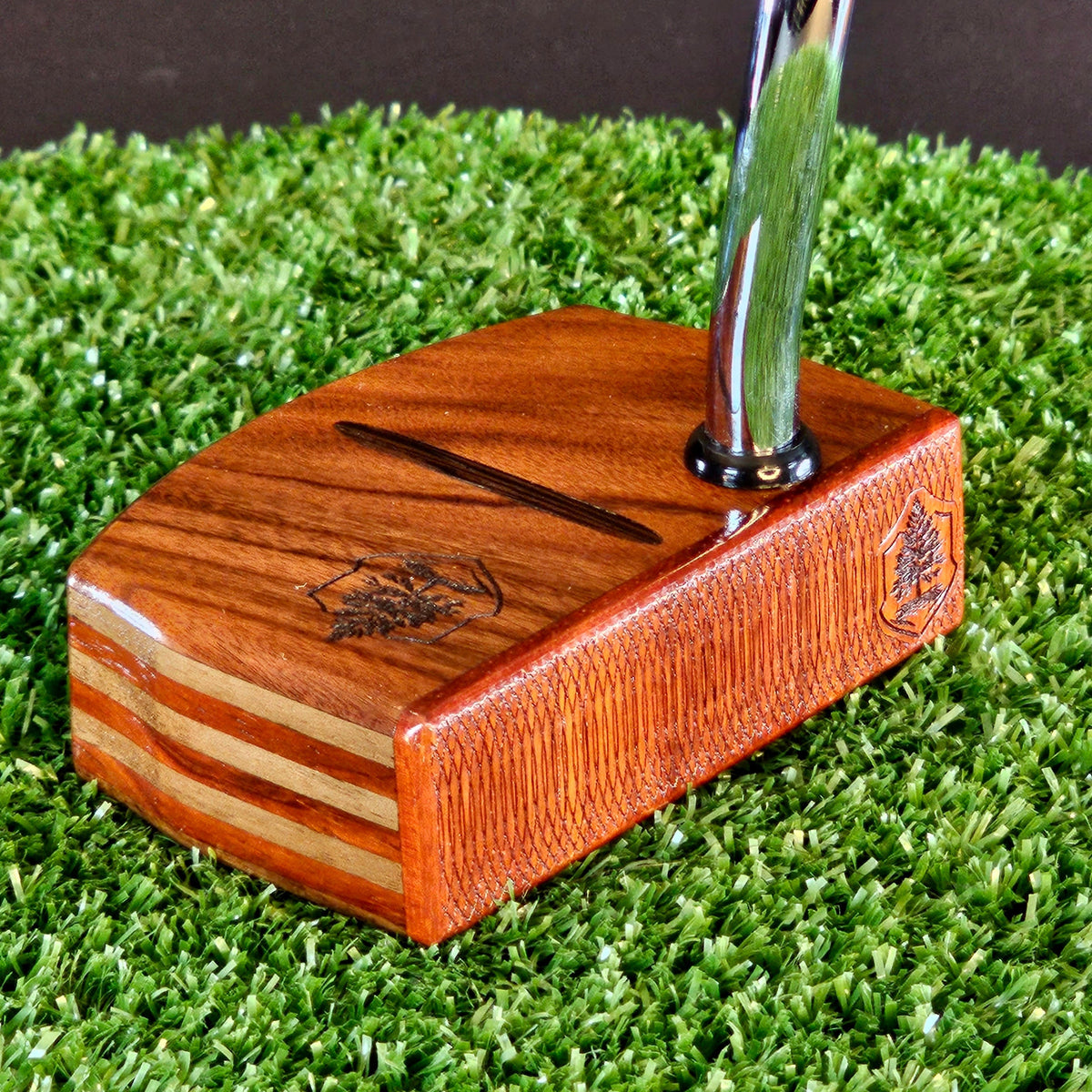 Golfer studying the line of a putt while reading the green