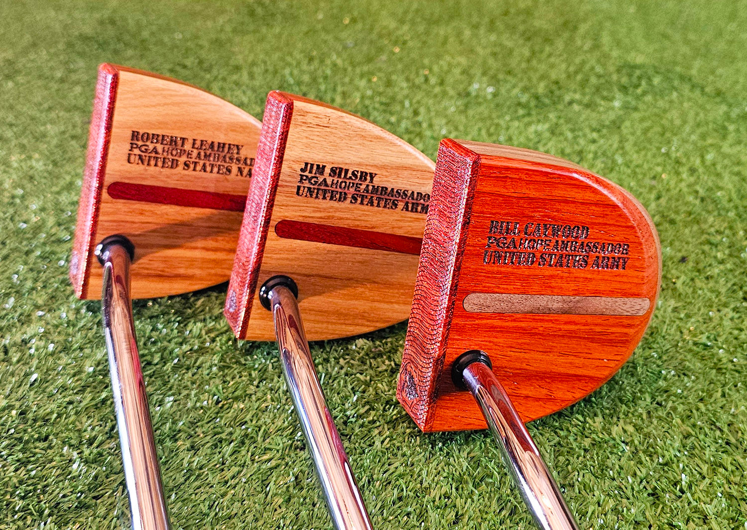 Three custom engraved TimberTouch putters for PGA HOPE Ambassadors
