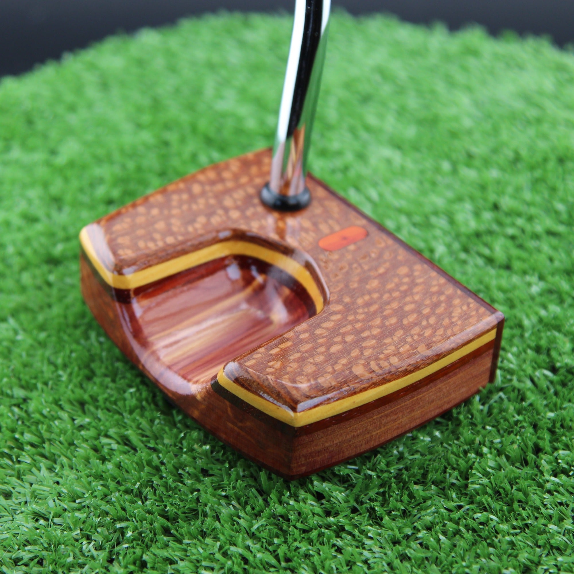 Leopardwood, cedar and padauk Woodrich Regal putter on the green
