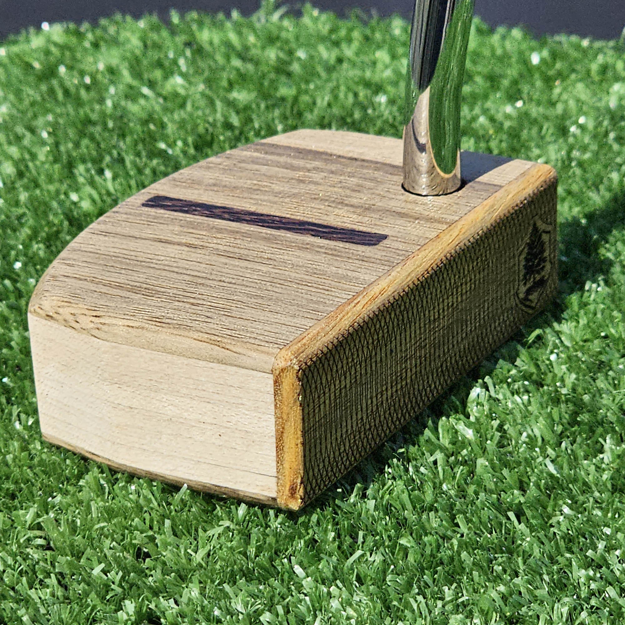 Black Limba and Hard Red Oak putter with clean line top alignment feature