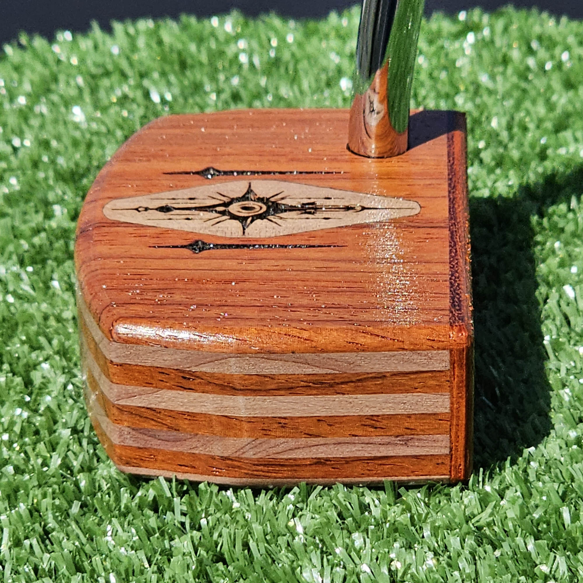 Layered Bloodwood and Red Cedar putter with decorative inlay