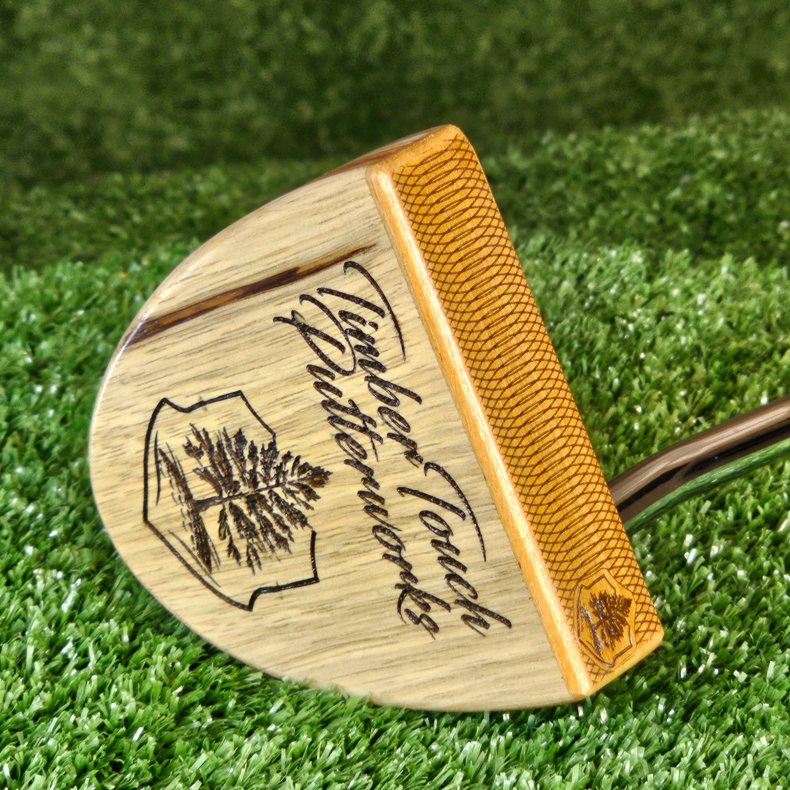 Black Limba exotic wood putter with various body plies and Osage Orange face