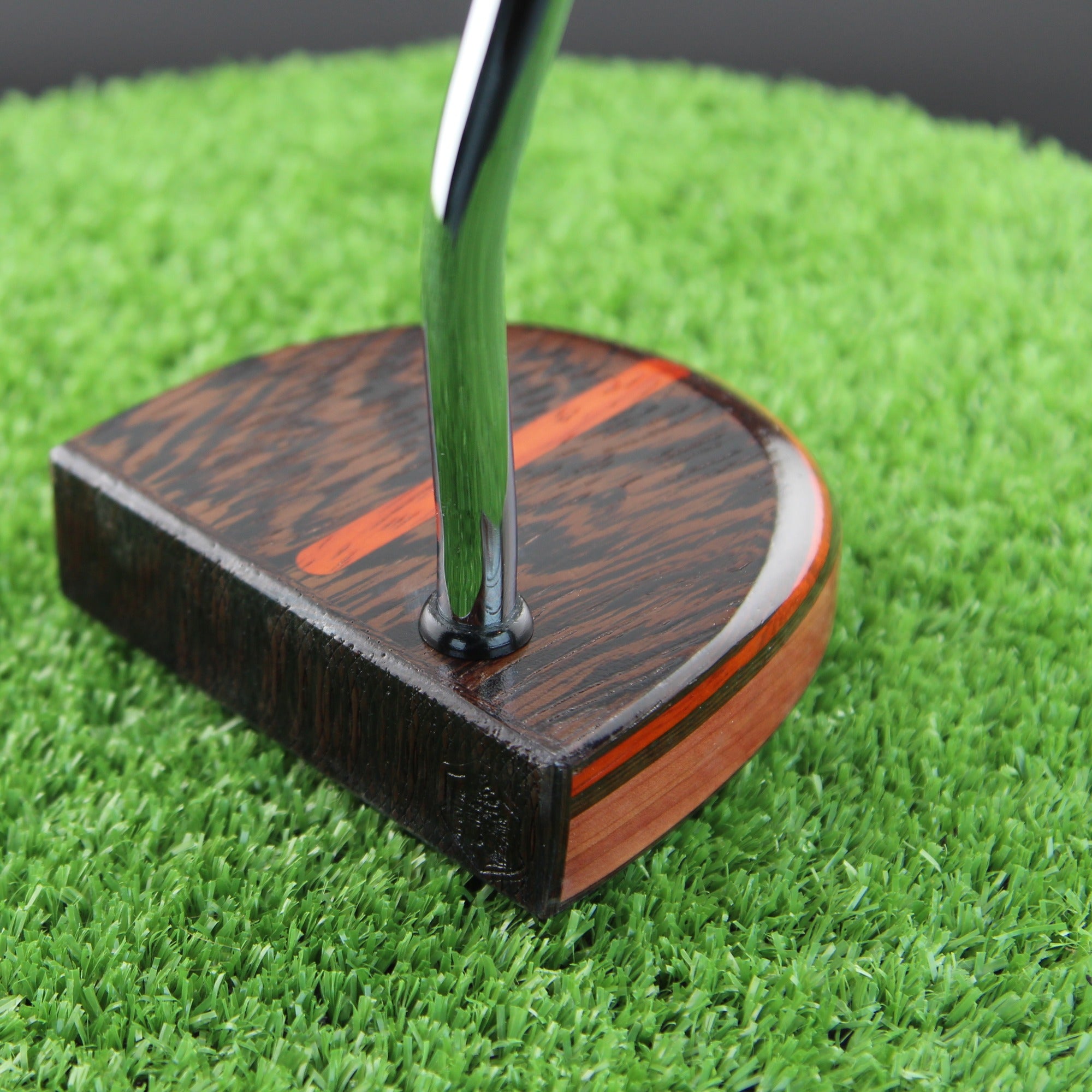 TimberTouch Black Ember Fatty mallet putter in Wenge, Padauk and Cedar - face view at address with golf ball