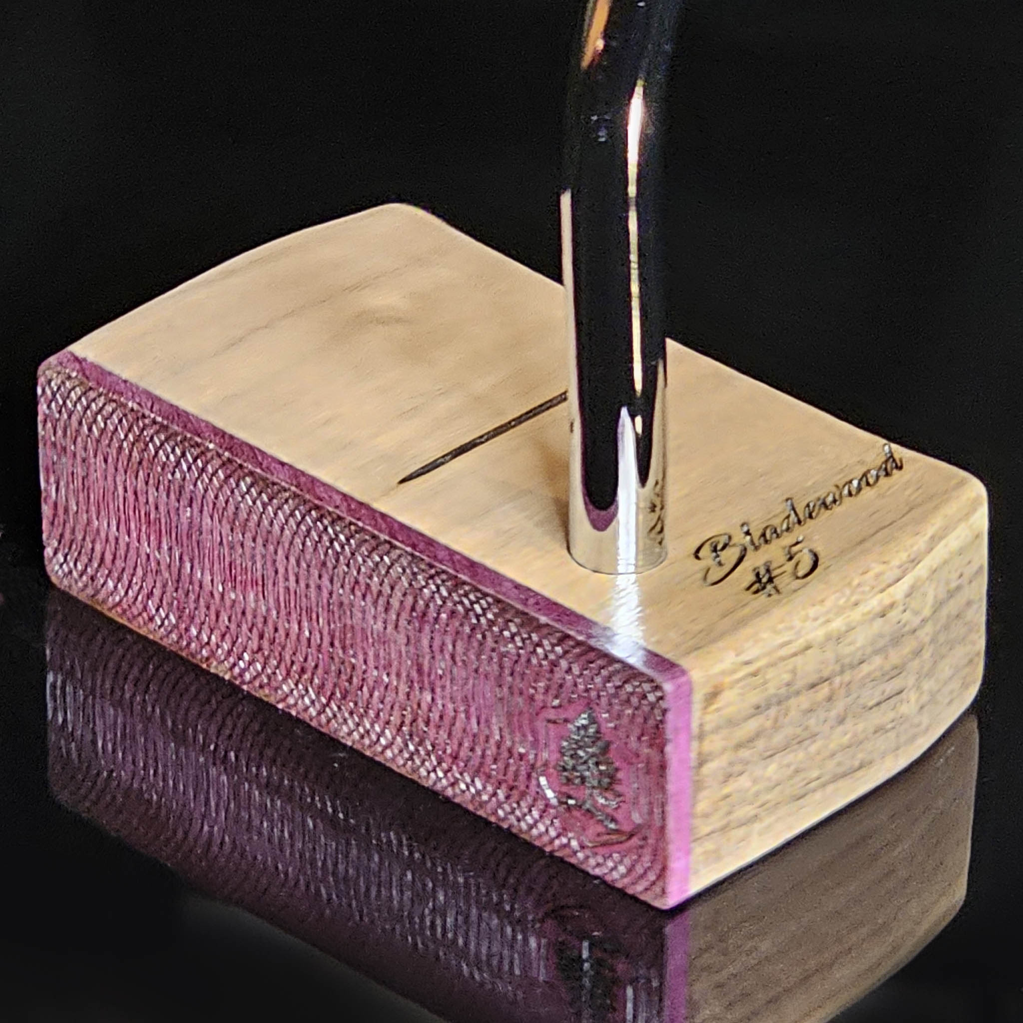 Walnut wood body putter with Purpleheart face.   Clean alignment line top view