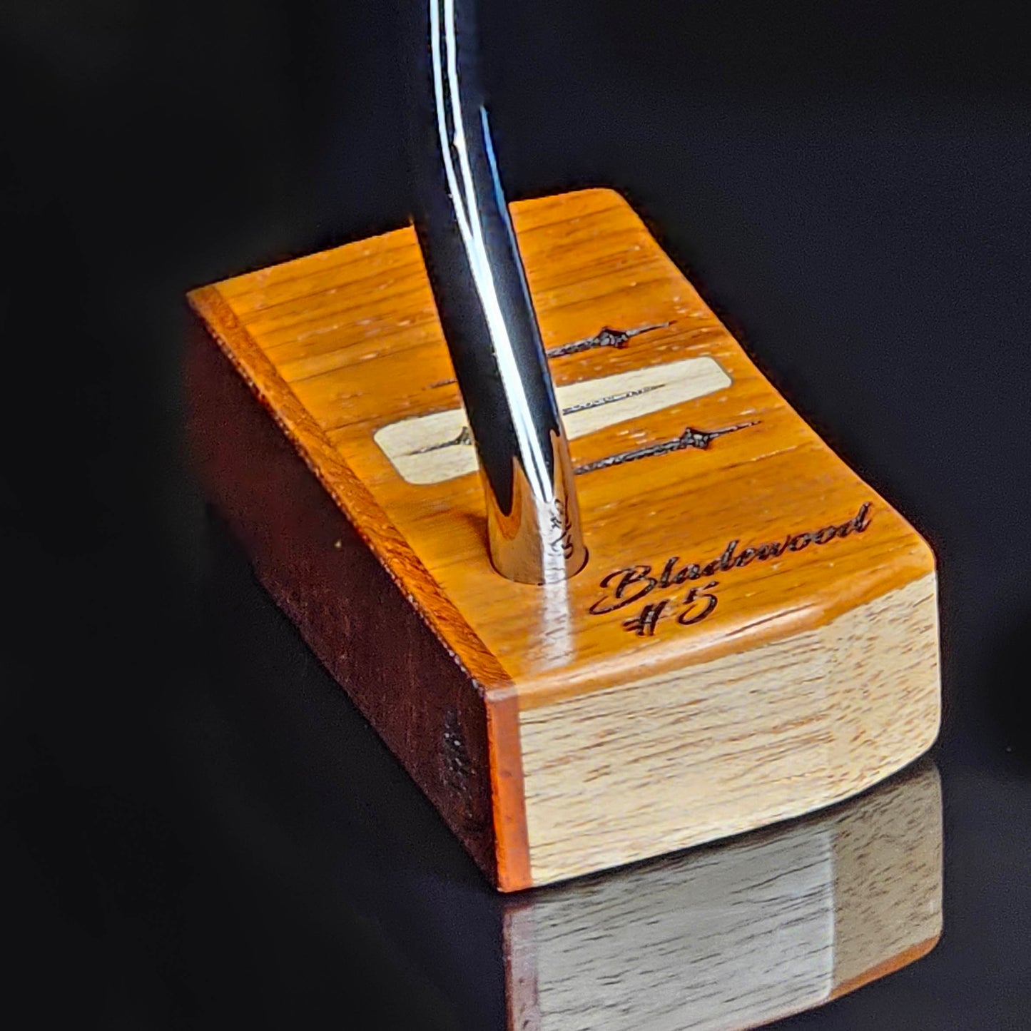 Bloodwood top and faceplate putter with Mahogany body.  Inlay design