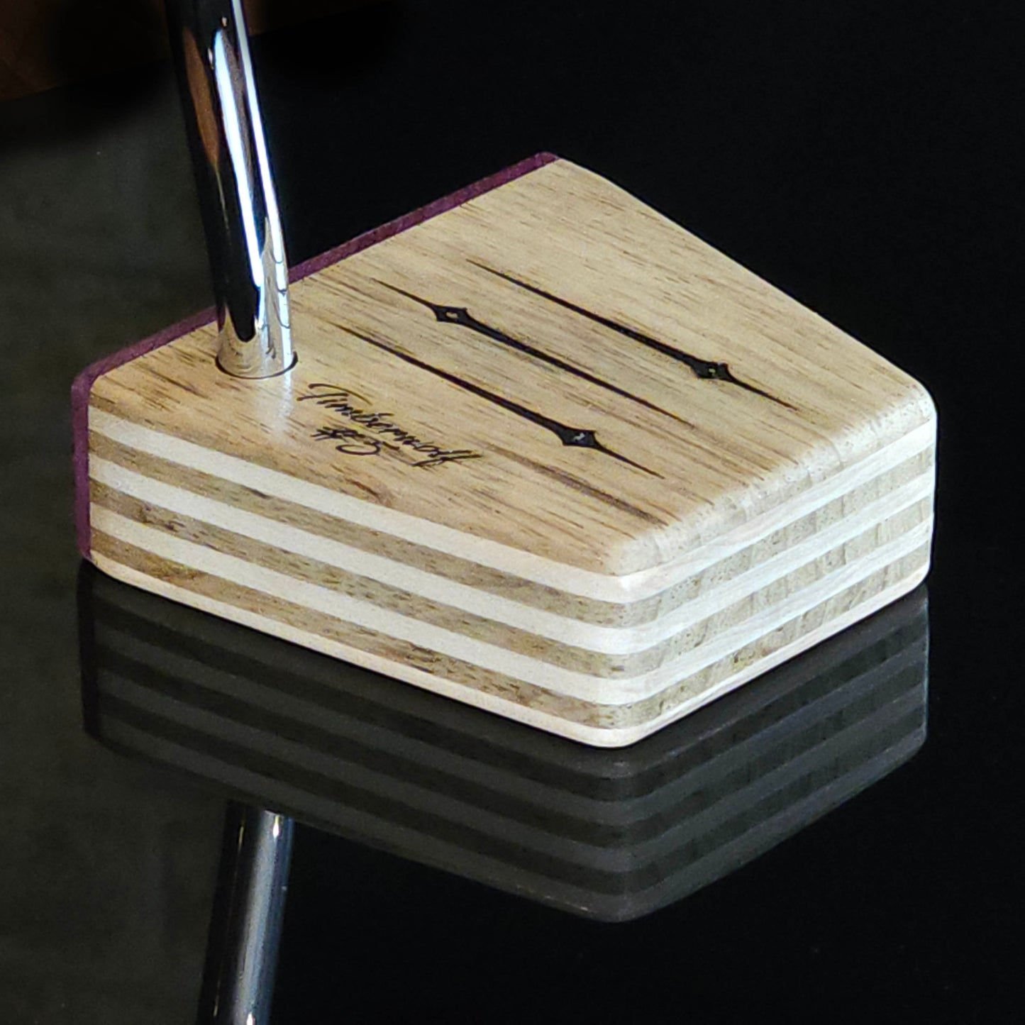 Black Limba wood and maple layered putter with purpleheart faceplate