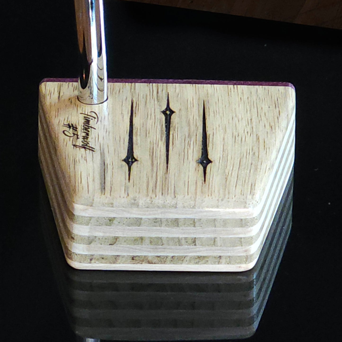 Black Limba wood and maple layered putter with purpleheart faceplate