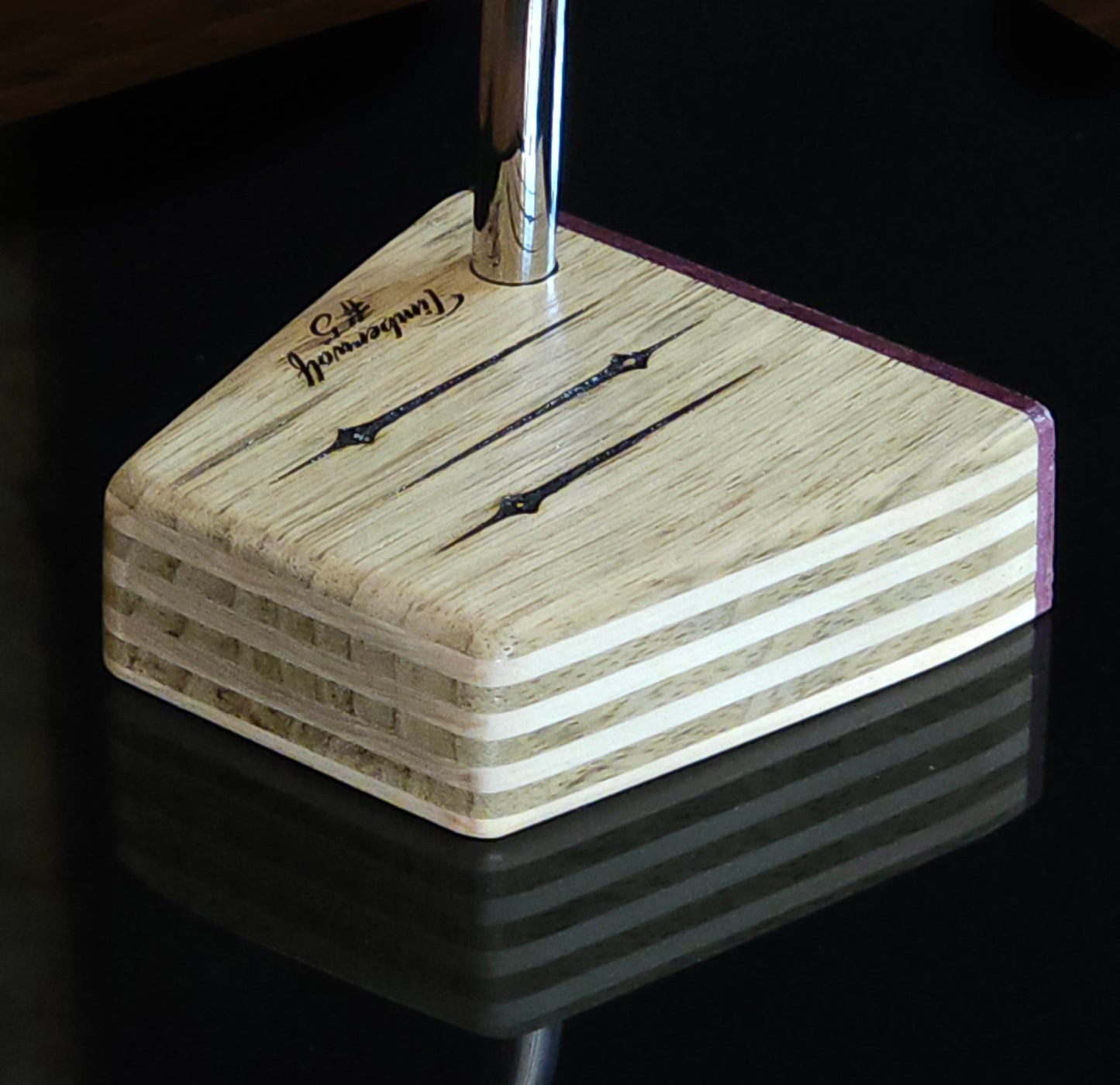 Black Limba wood and maple layered putter with purpleheart faceplate