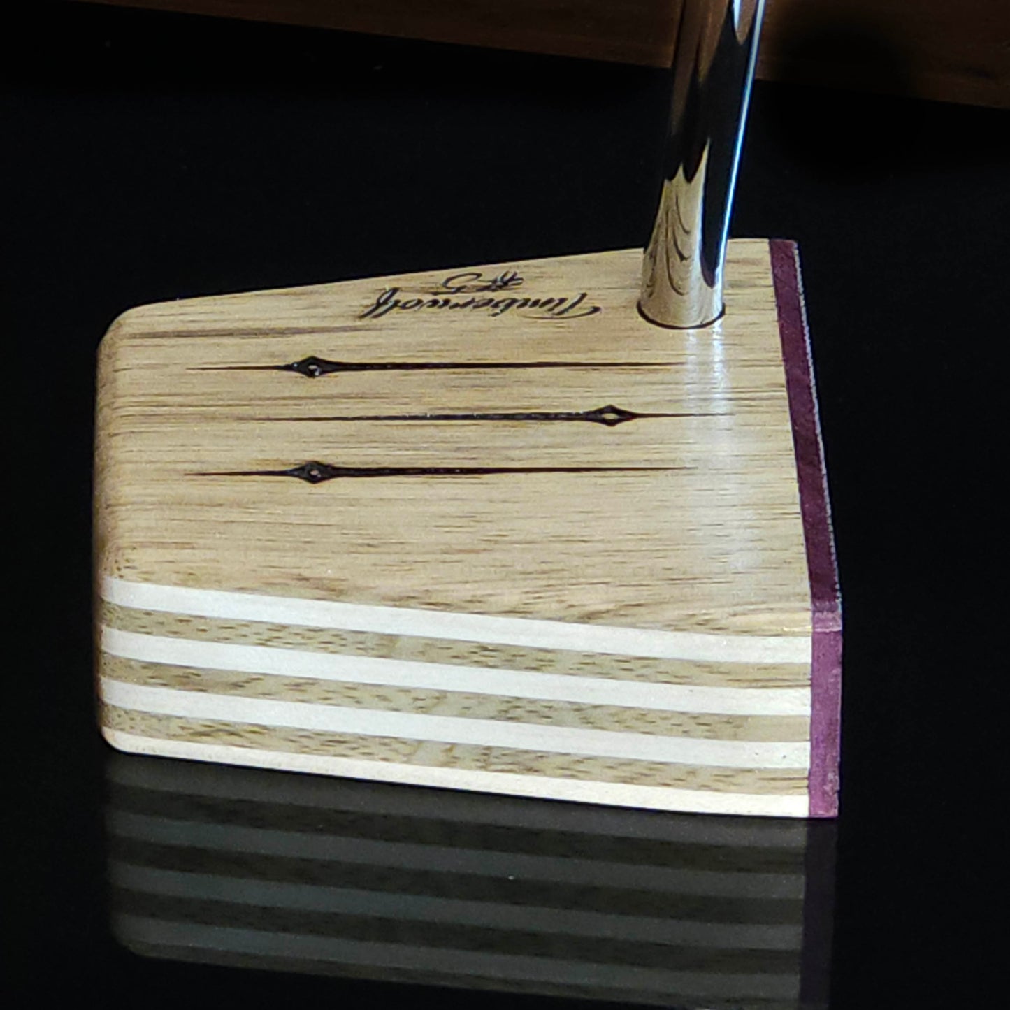 Black Limba wood and maple layered putter with purpleheart faceplate