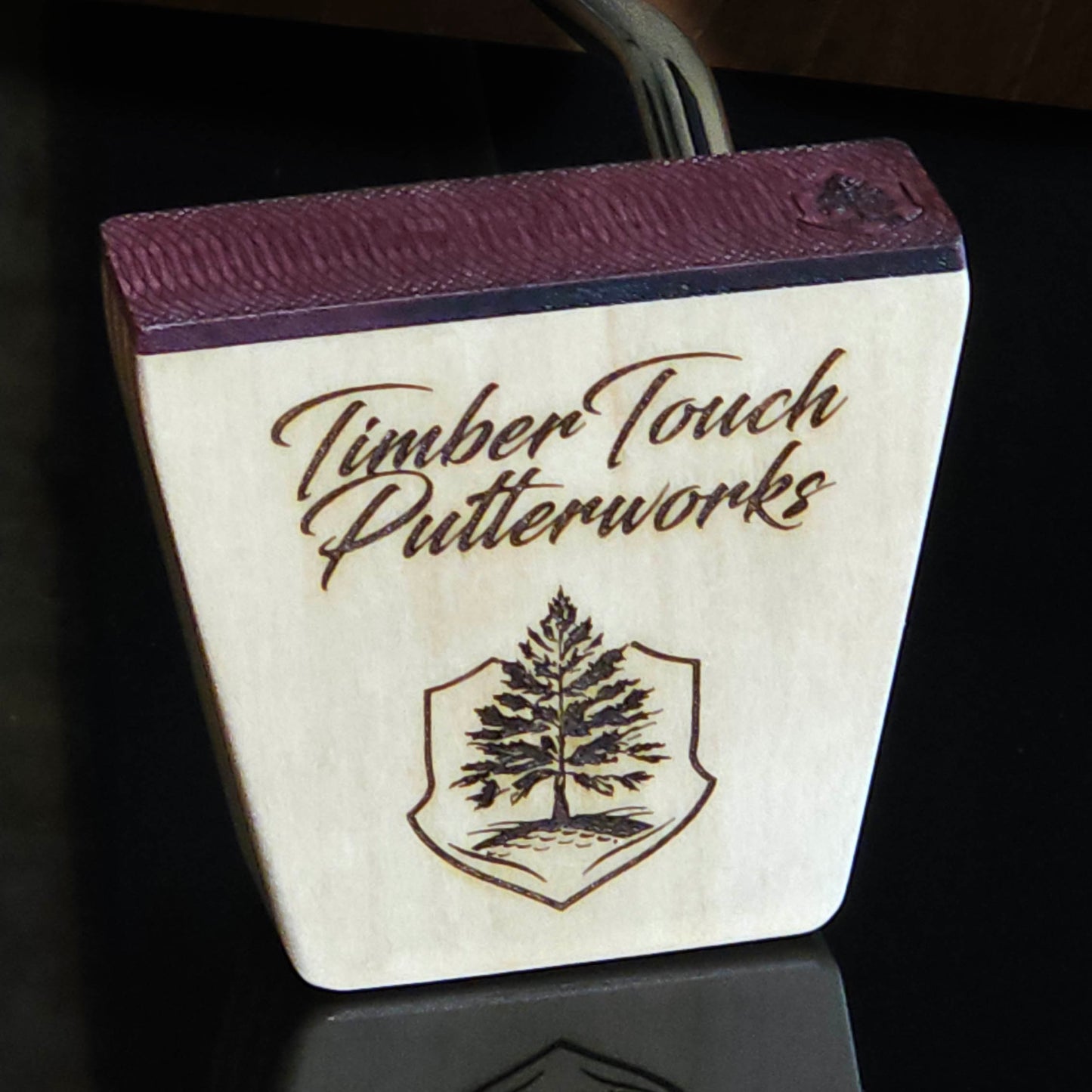 Black Limba wood and maple layered putter with purpleheart faceplate