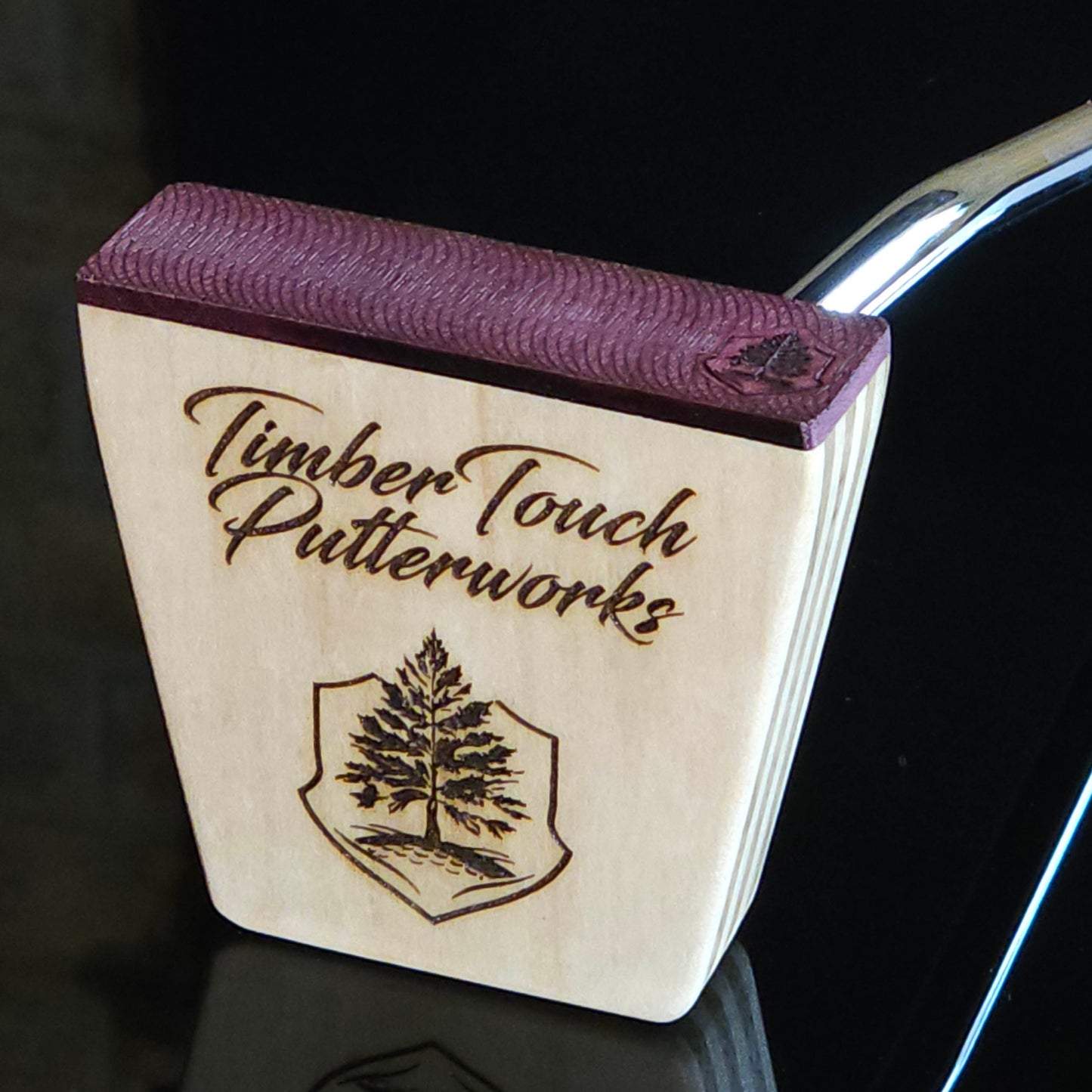 Black Limba wood and maple layered putter with purpleheart faceplate