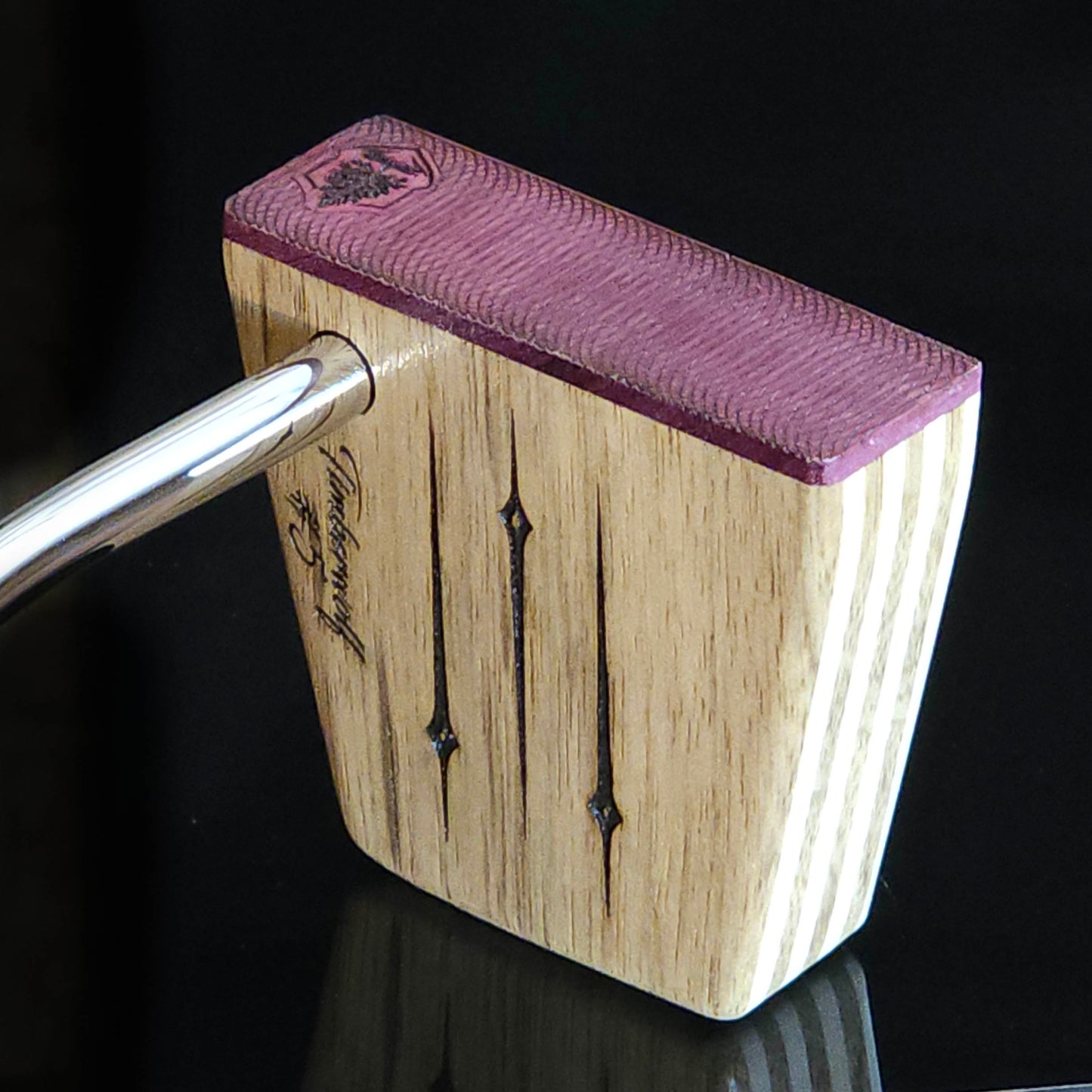 Black Limba wood and maple layered putter with purpleheart faceplate