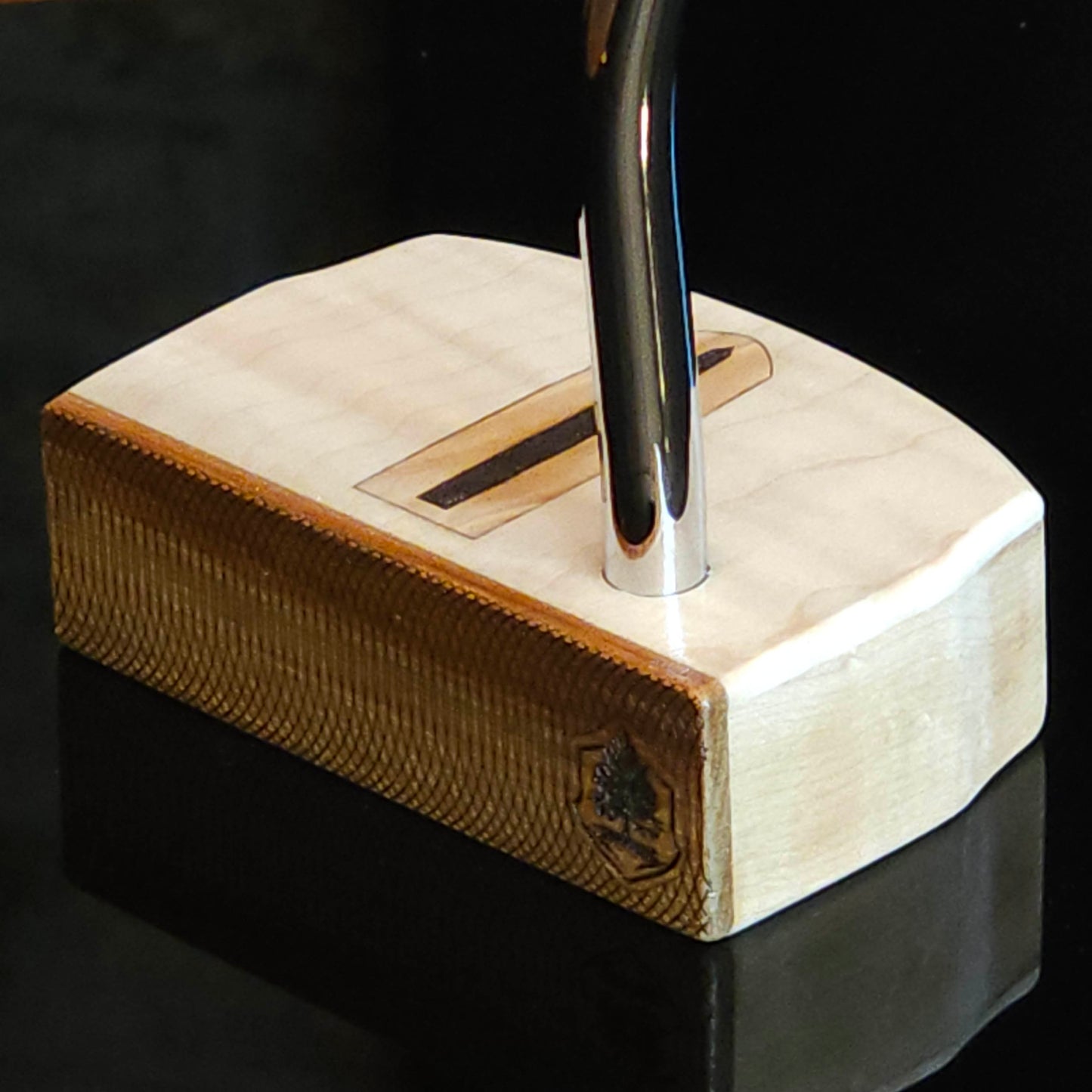 Curly Maple putter with canarywood faceplate and olivewood inlay