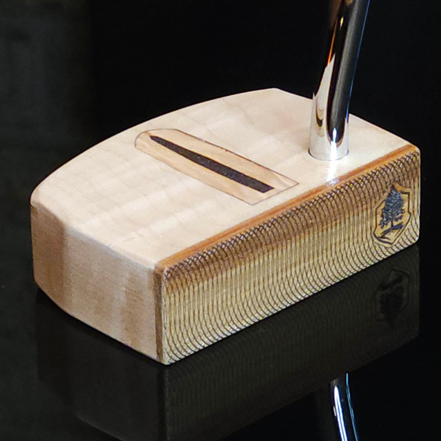 Curly Maple putter with canarywood faceplate and olivewood inlay