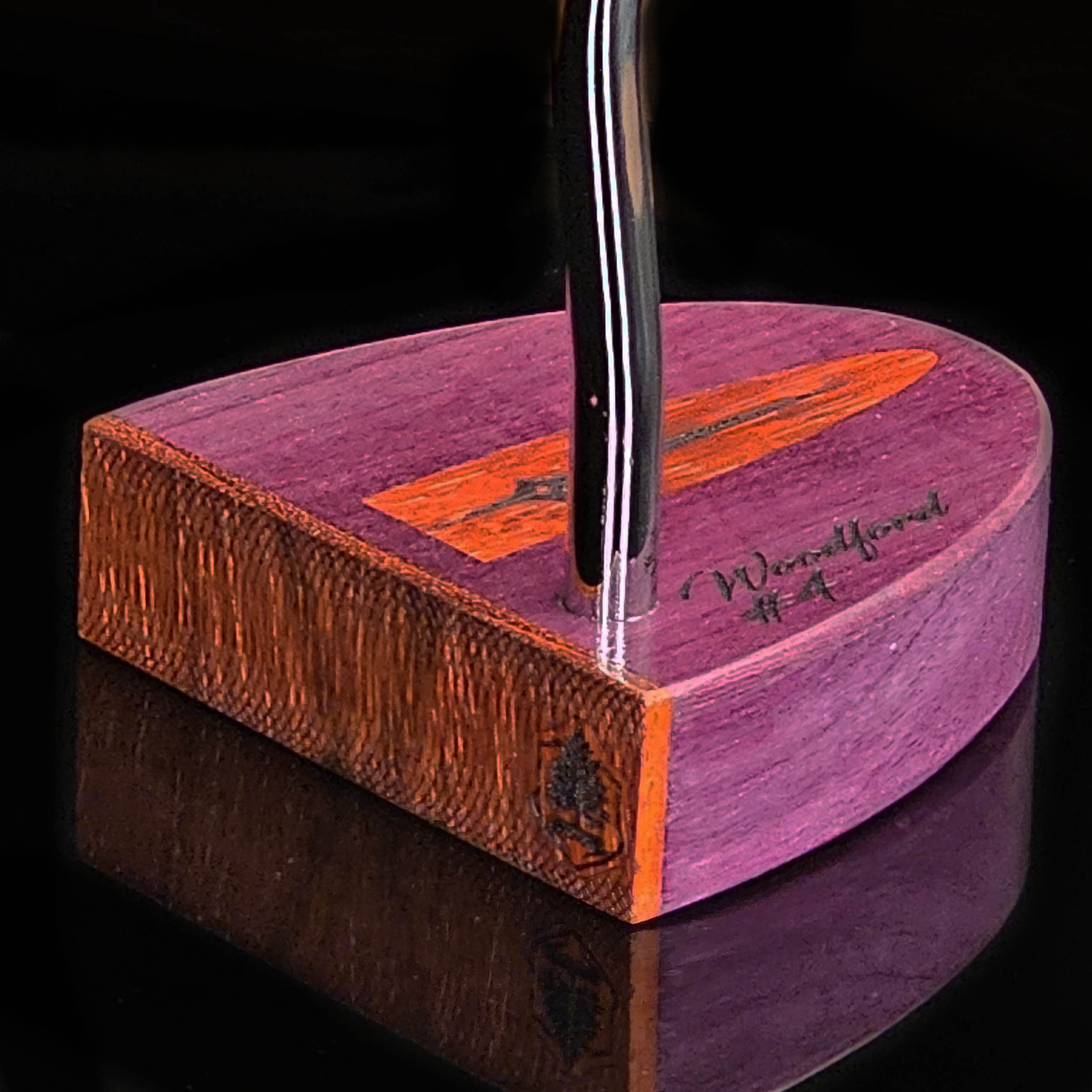 Purpleheart wood putter with Paduak wood inlay and faceplate