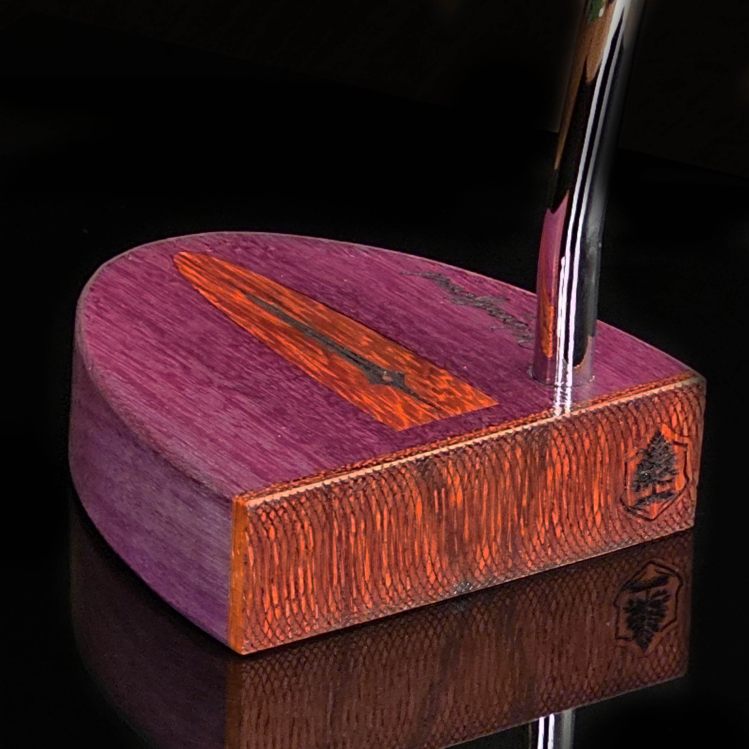 Purpleheart wood putter with Paduak wood inlay and faceplate