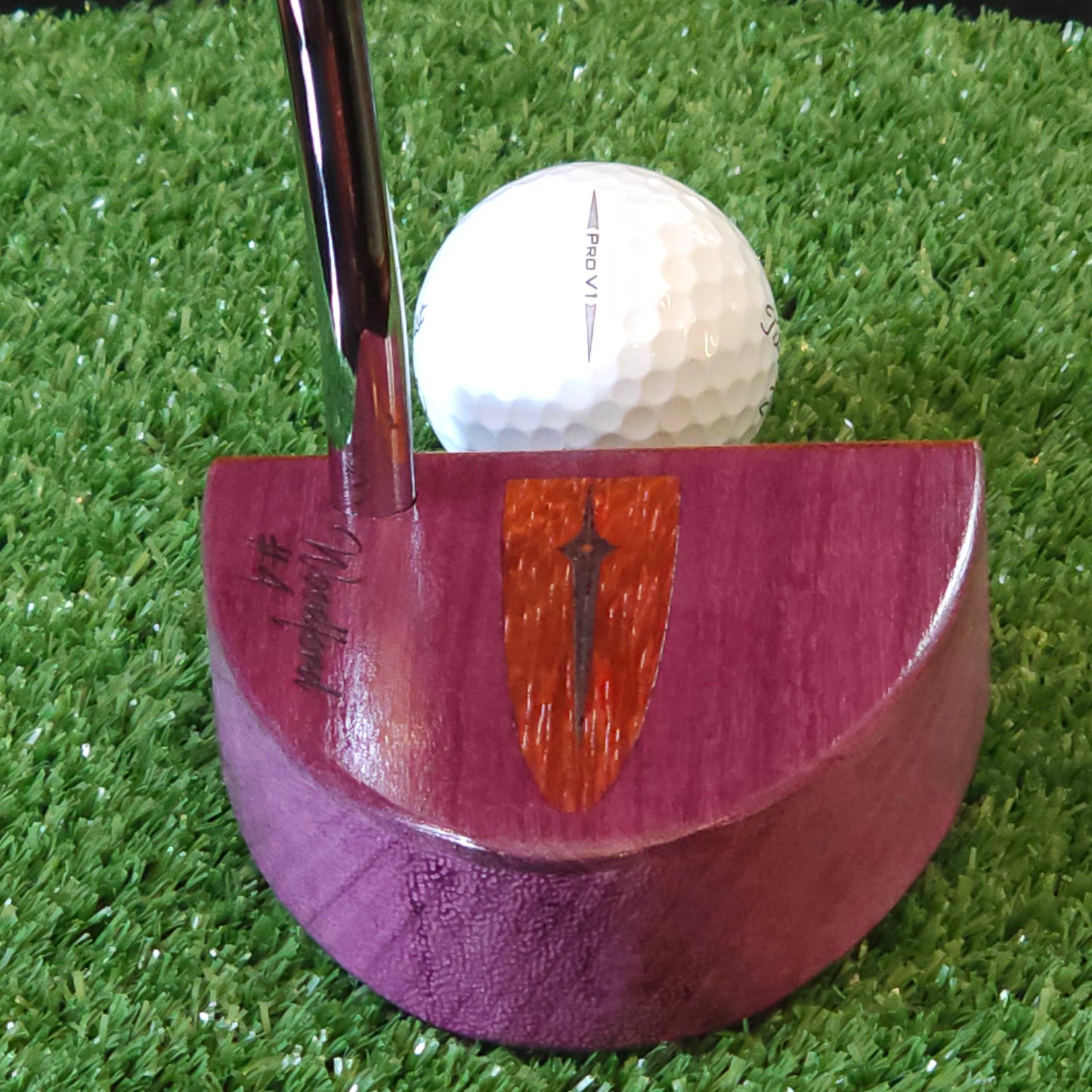 Purpleheart wood putter with Paduak wood inlay and faceplate