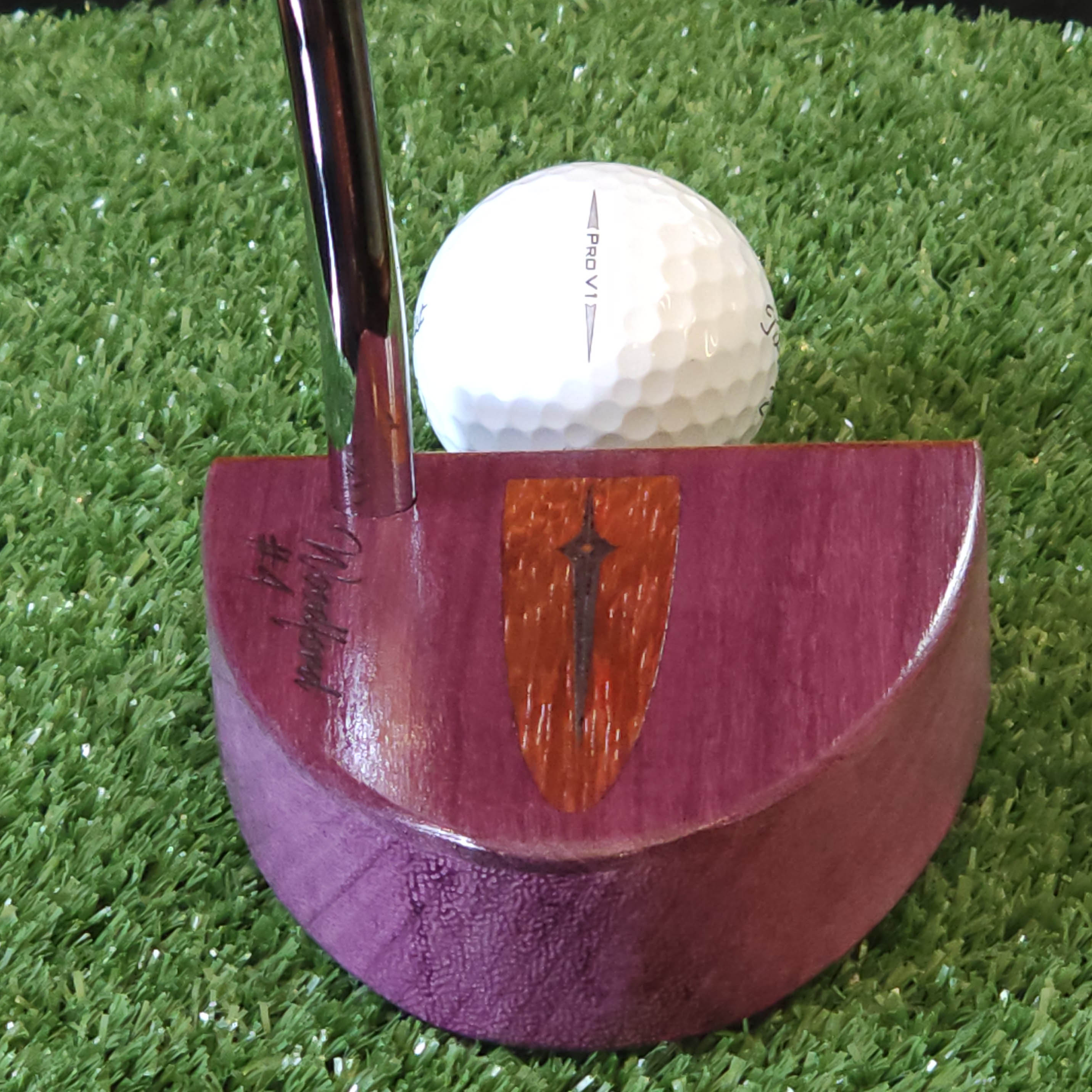 Purpleheart wood putter with Paduak wood inlay and faceplate