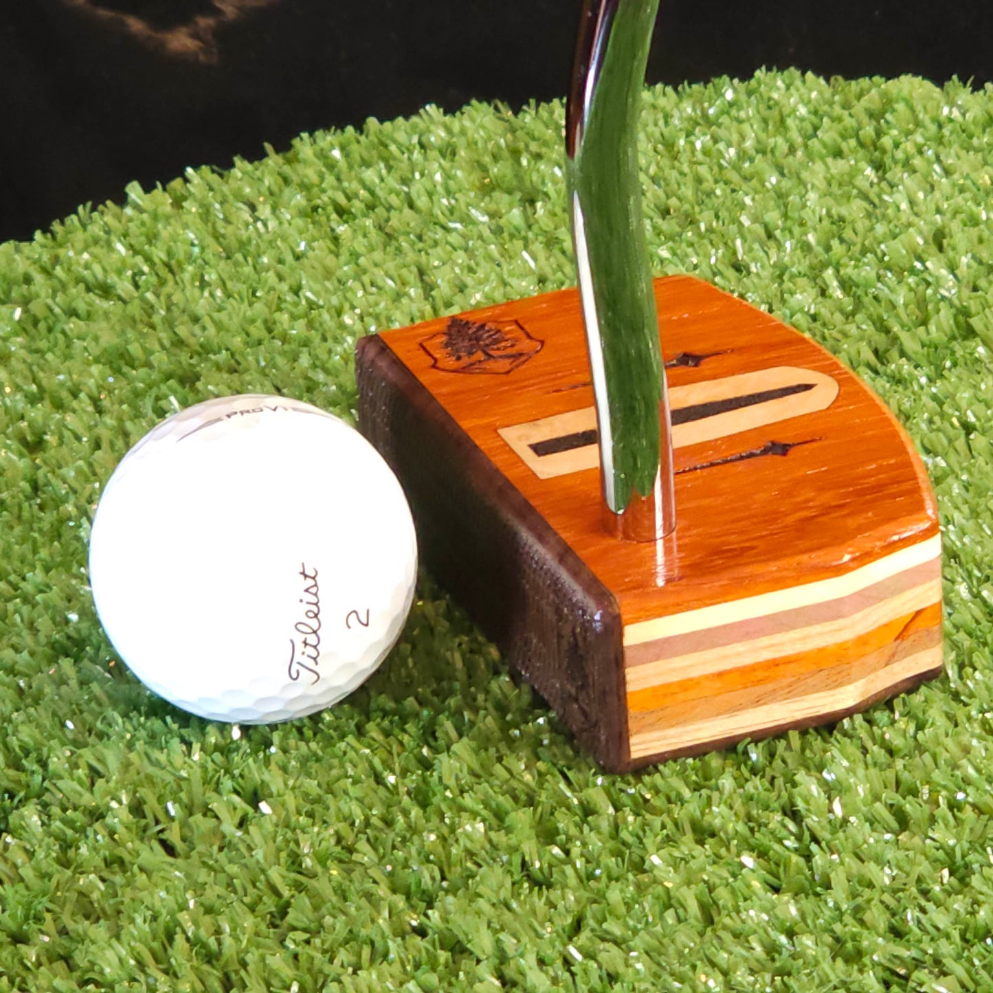 Paduak and Bubinga wood putter with many wood plied body, Olivewood inlay