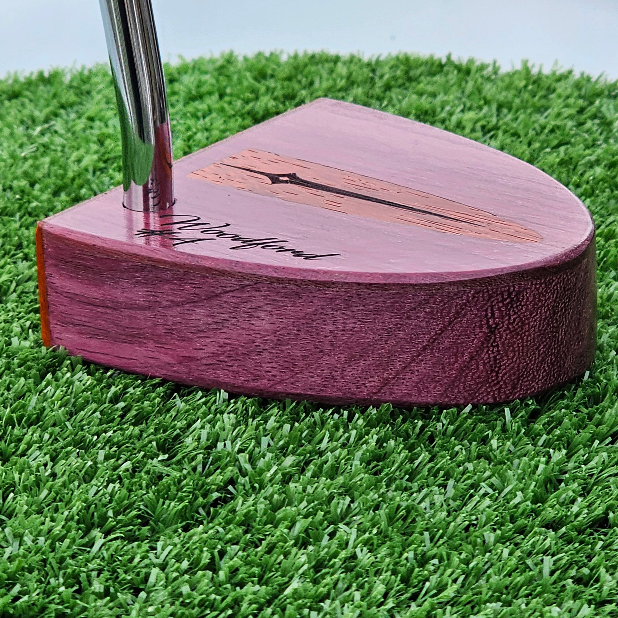 Purpleheart wood putter with Paduak wood inlay and faceplate