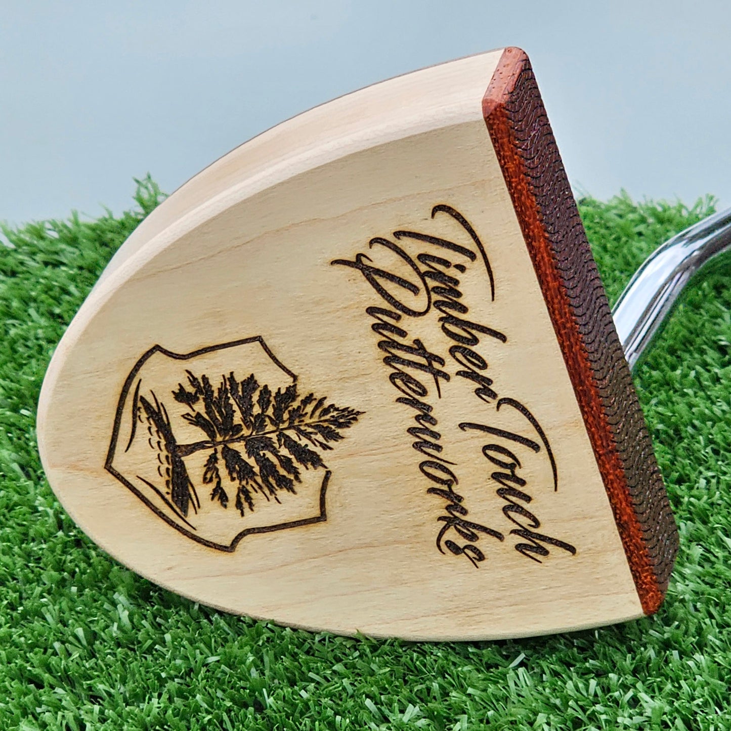 Curly Maple Body, Red Cedar top plate putter with Padauk Face plate