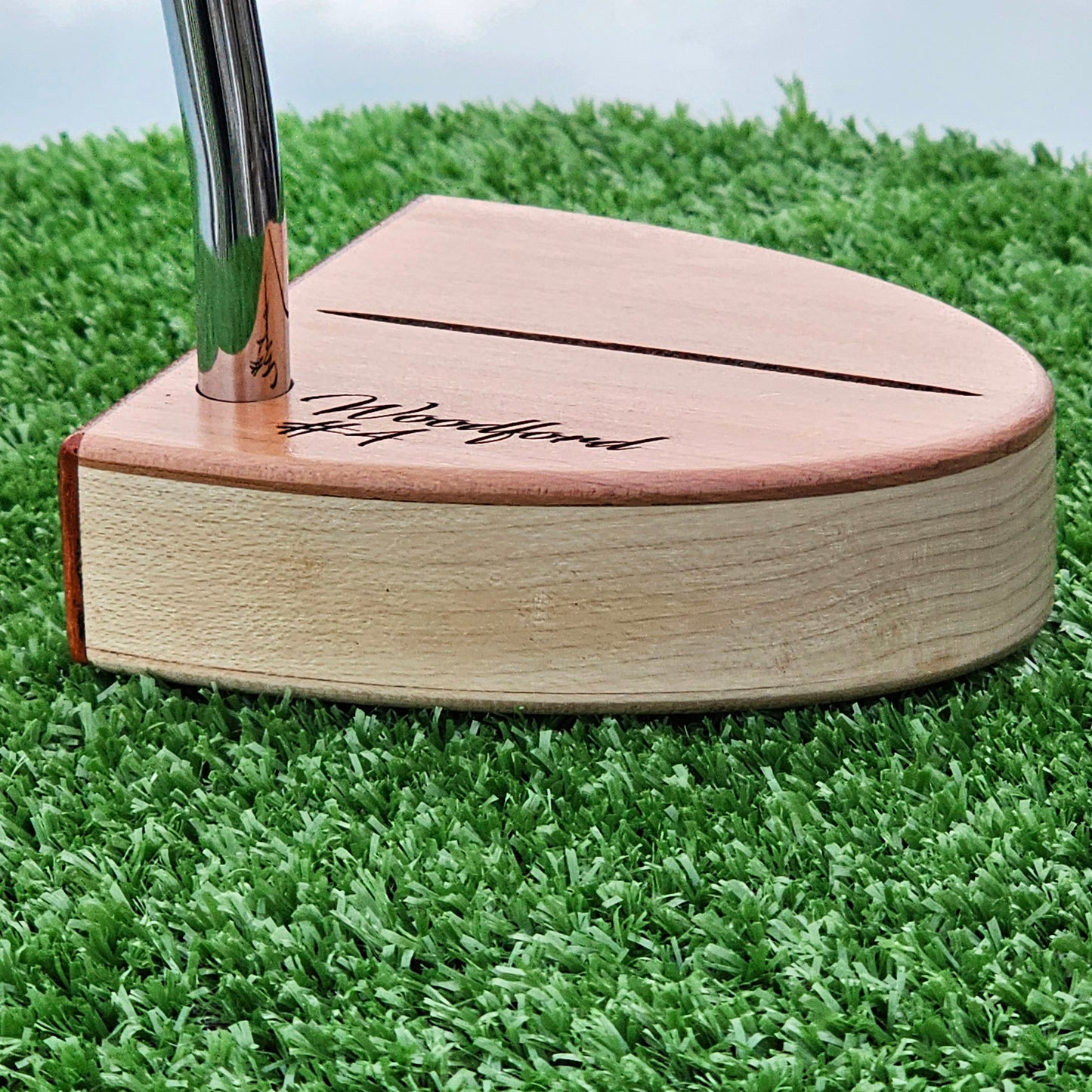 Curly Maple Body, Red Cedar top plate putter with Padauk Face plate