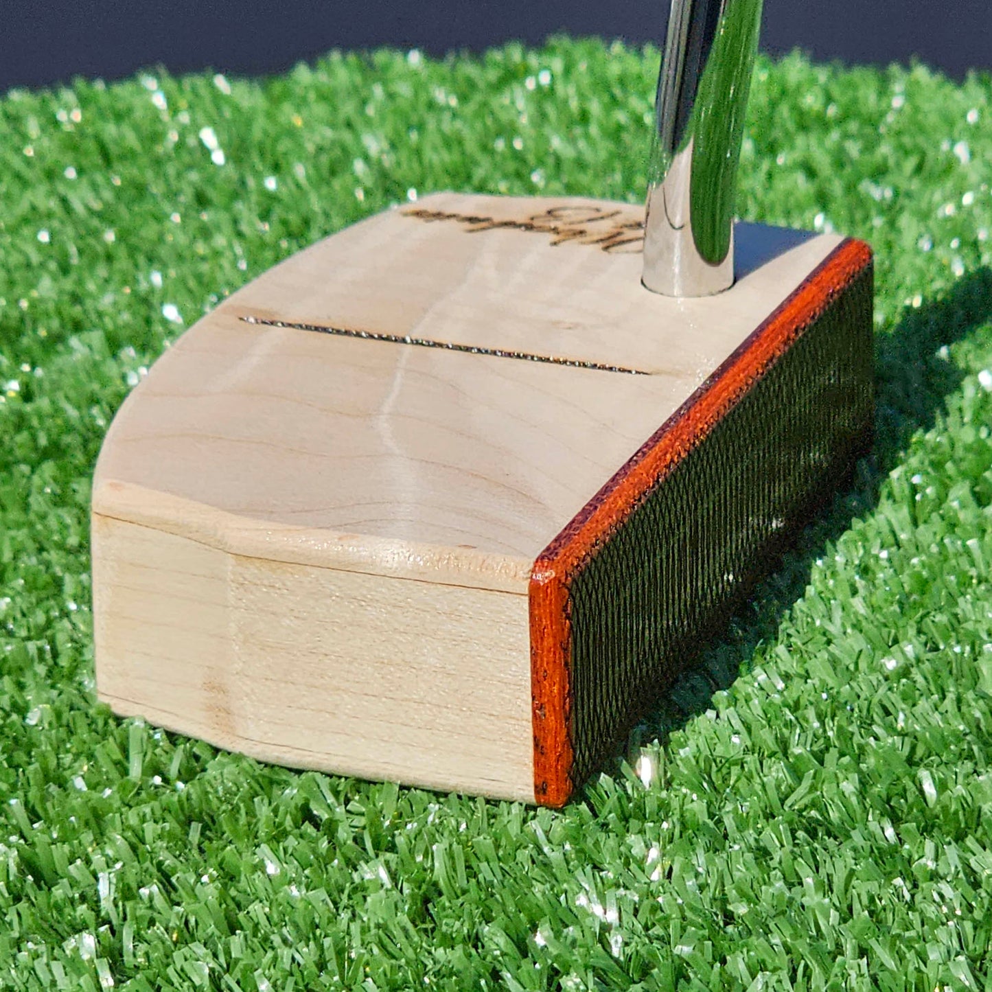 Curly Hard Maple putter with Red Padauk Face plate