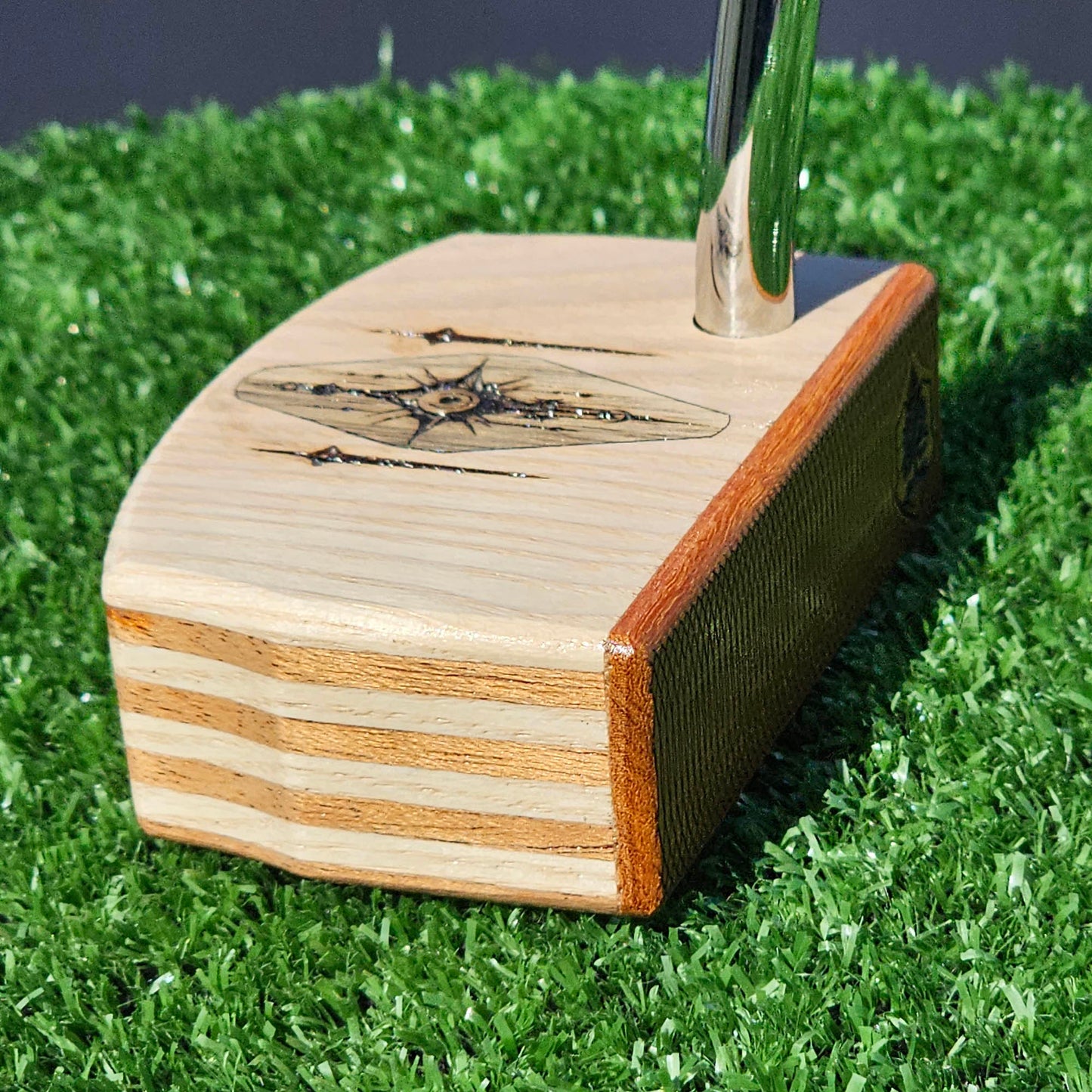 Layered Red Oak and Mahogany putter with decorative inlay