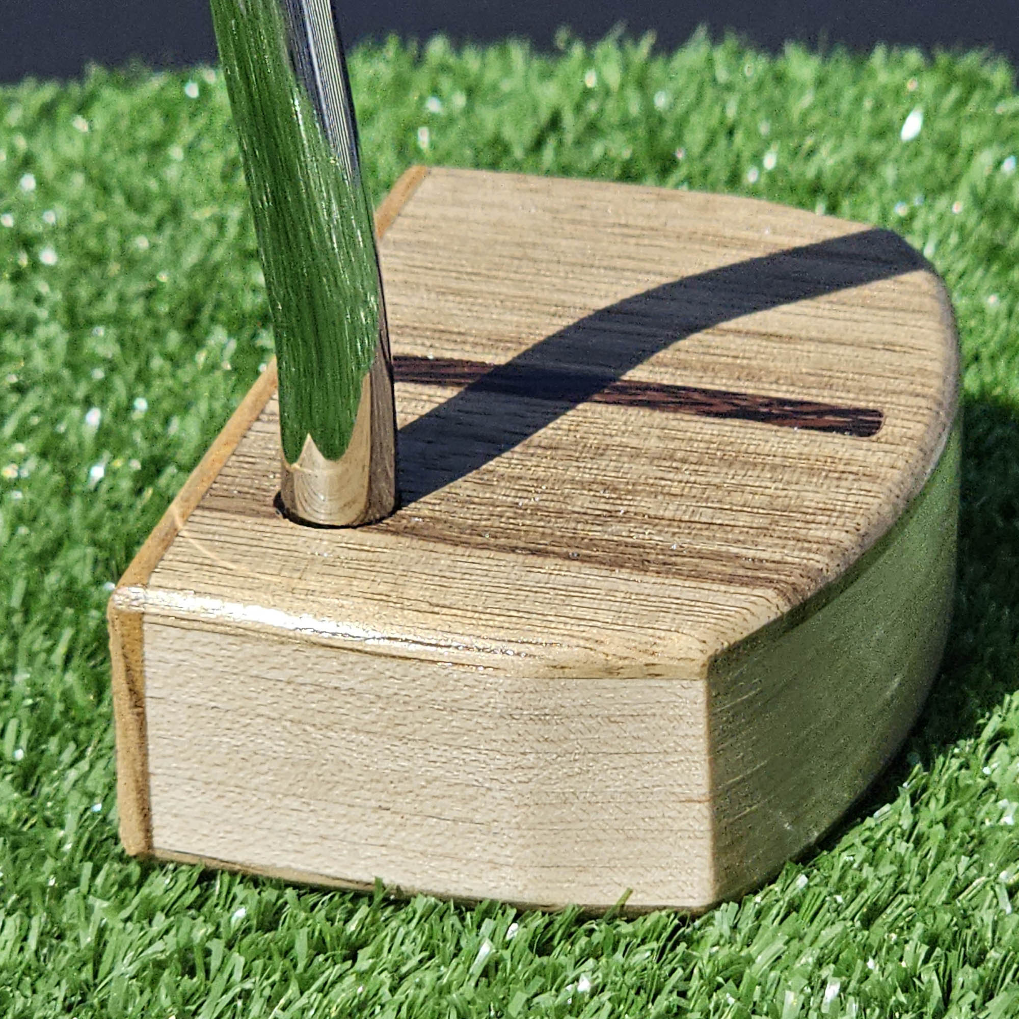 Black Limba and Hard Red Oak putter with clean line top alignment feature