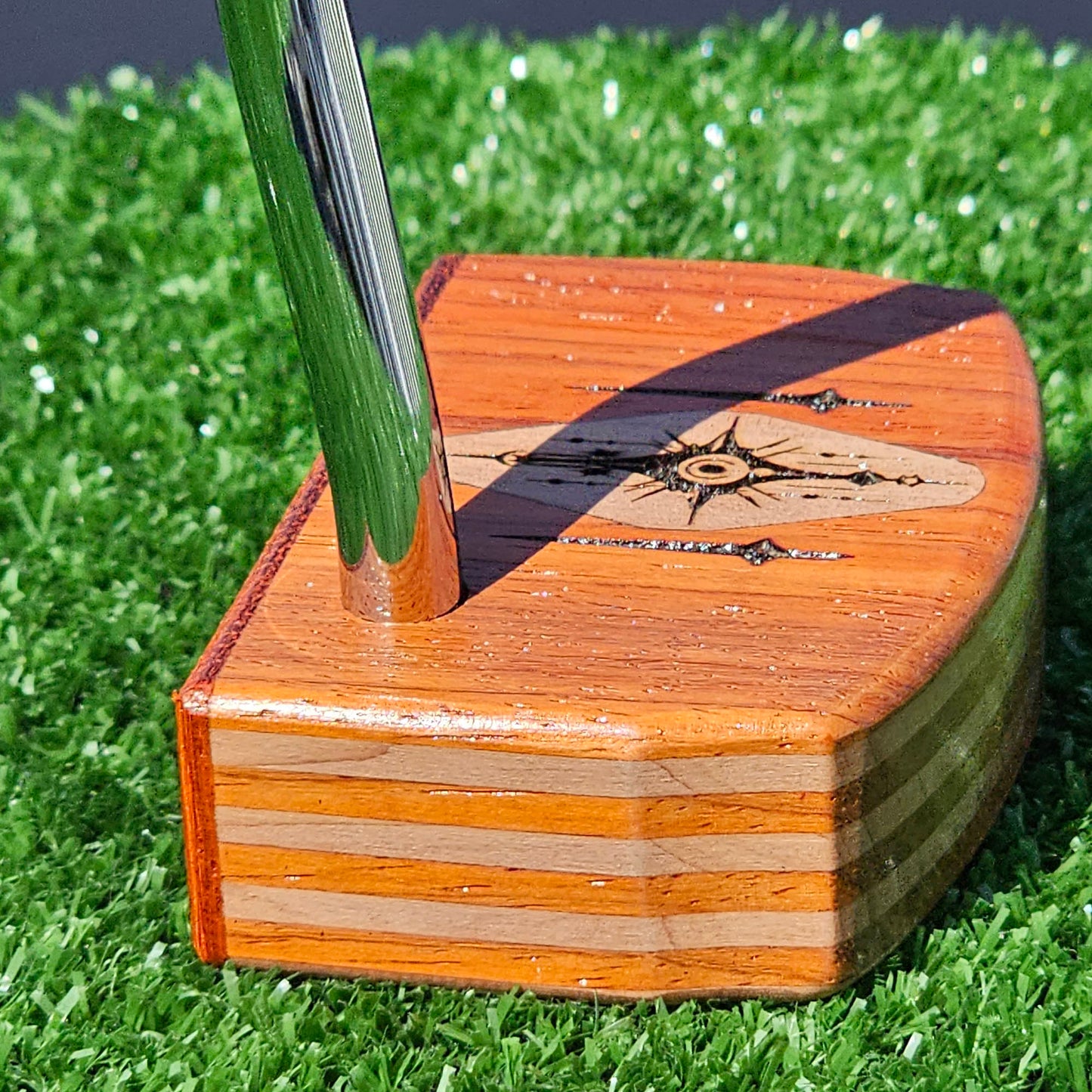 Layered Bloodwood and Red Cedar putter with decorative inlay