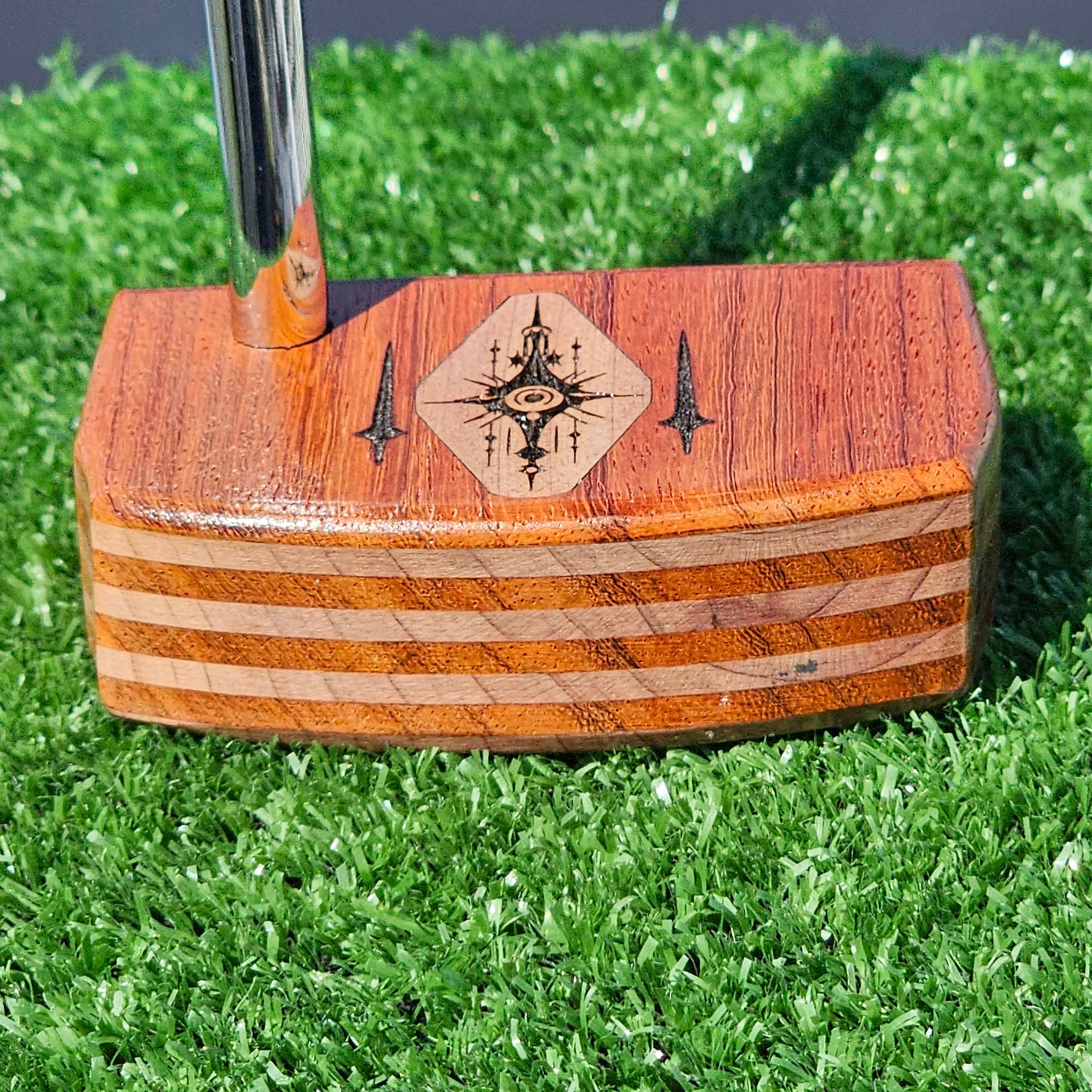 Layered Bloodwood and Red Cedar putter with decorative inlay