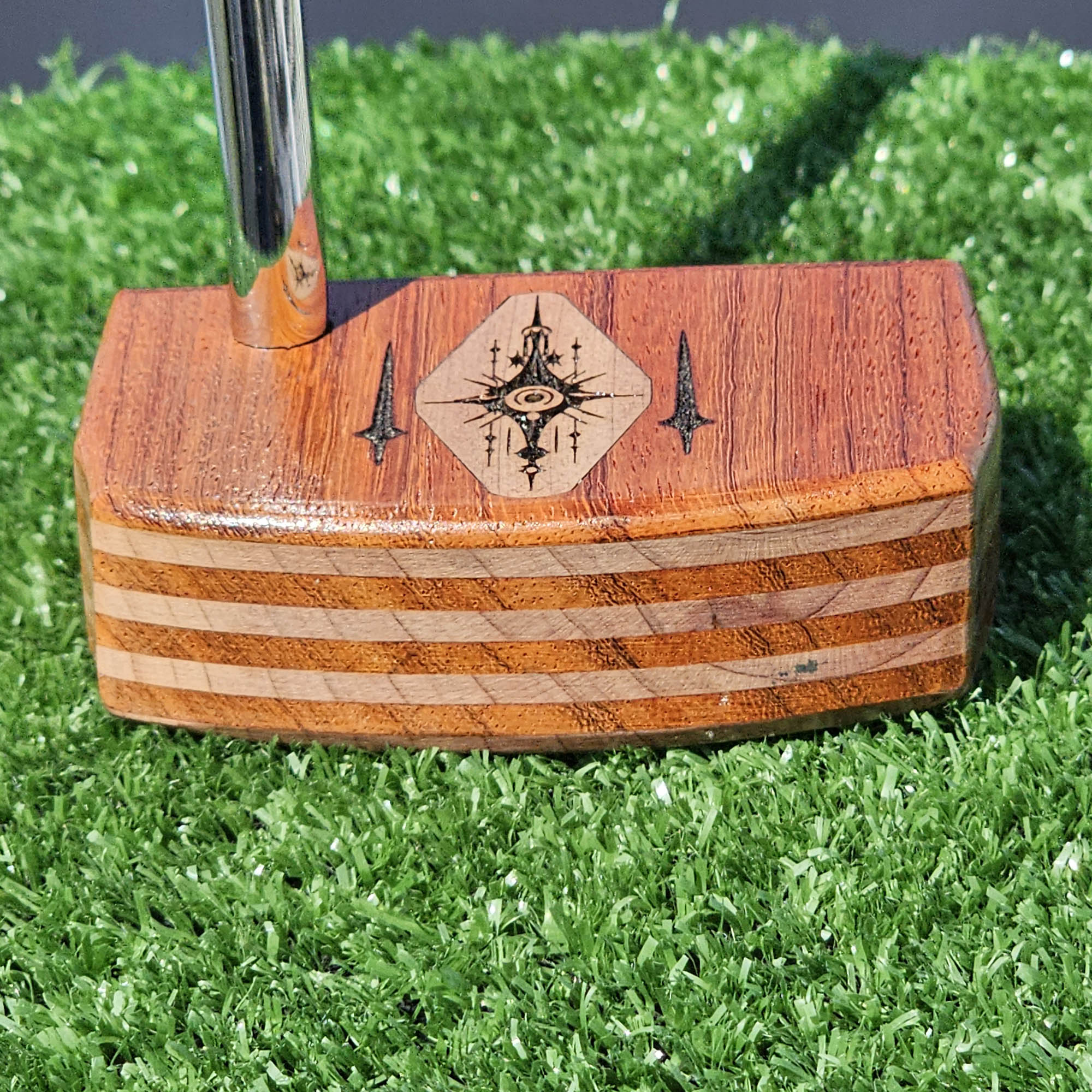Layered Bloodwood and Red Cedar putter with decorative inlay