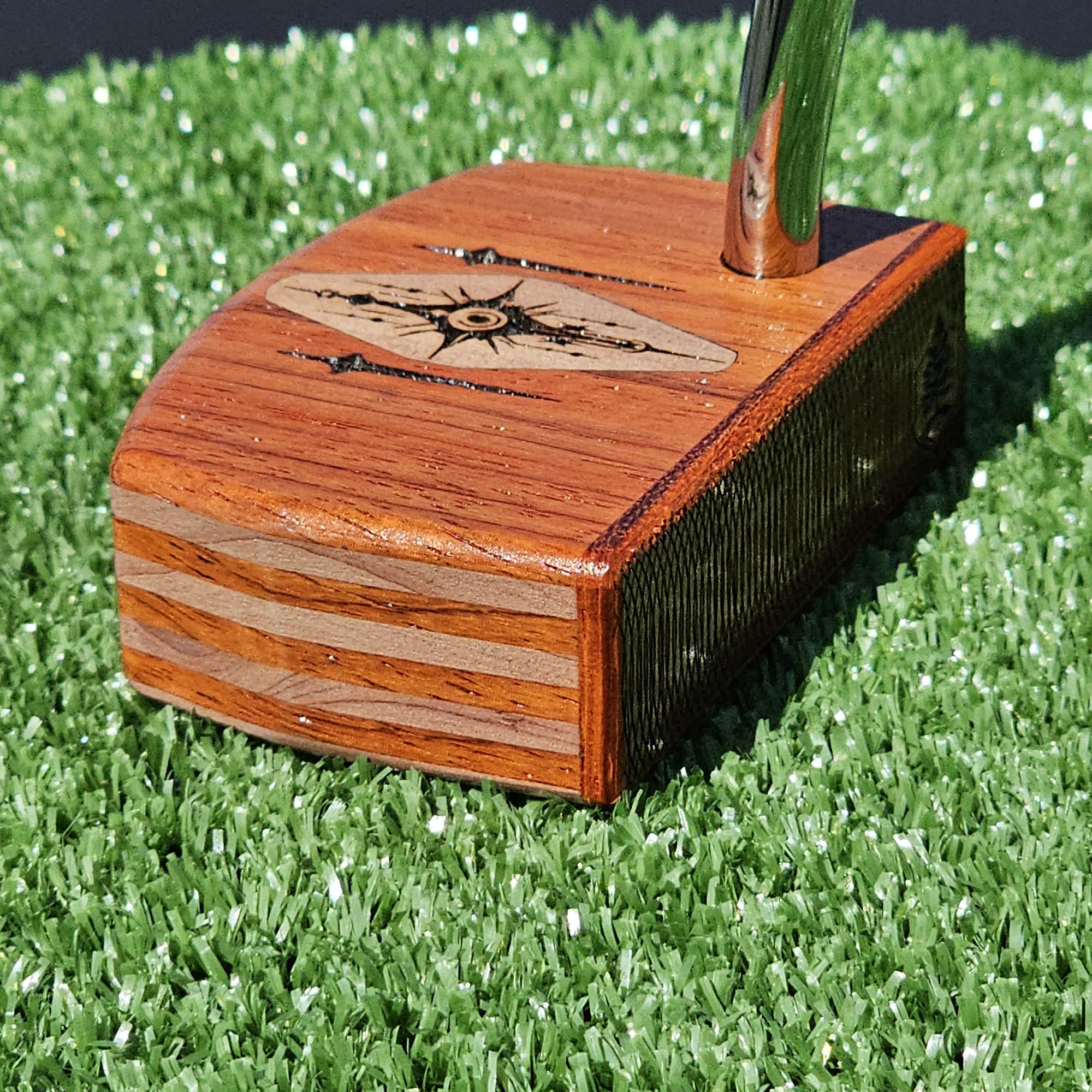 Layered Bloodwood and Red Cedar putter with decorative inlay