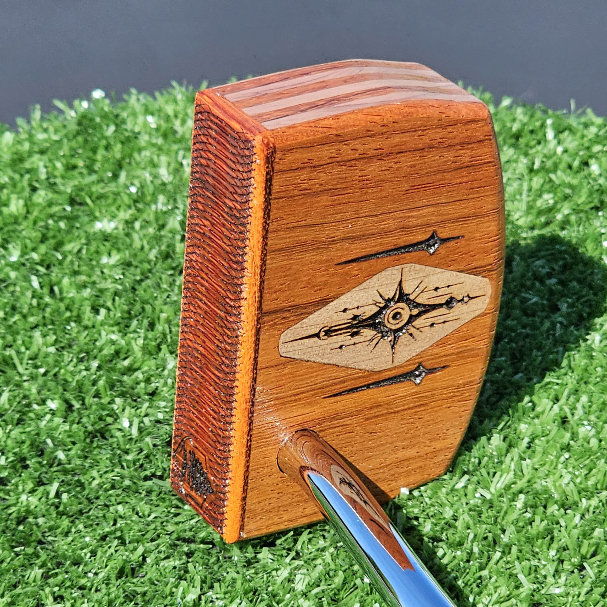 Layered Bloodwood and Red Cedar putter with decorative inlay