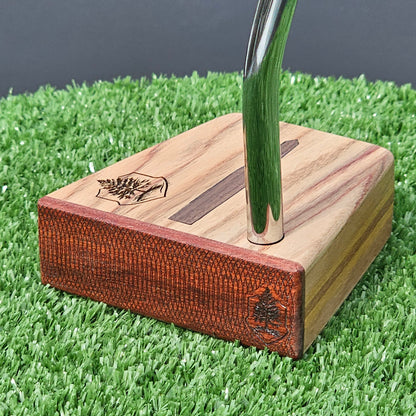 Canarywood and cedar layered putter with Paduak wood faceplate