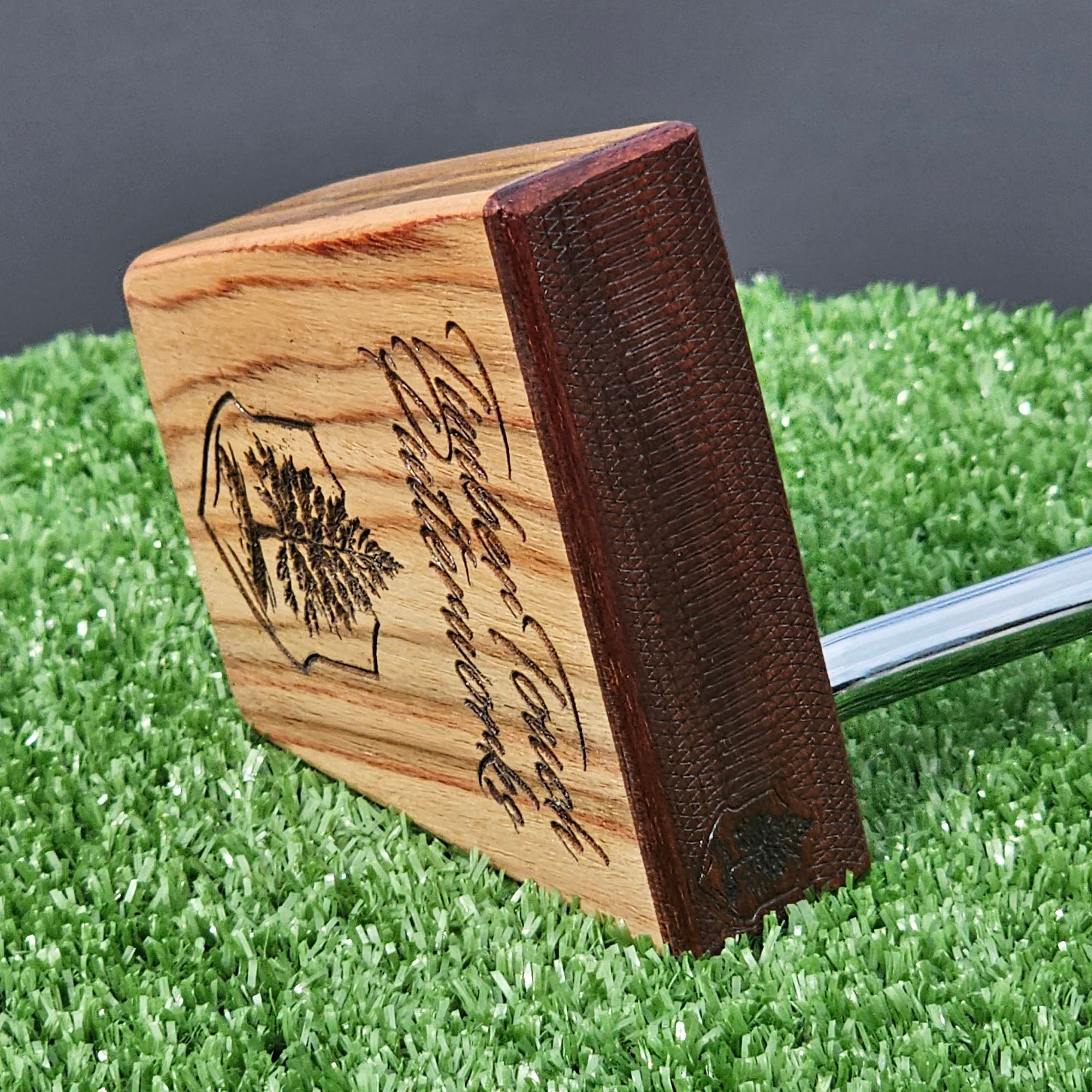 Canarywood and cedar layered putter with Paduak wood faceplate