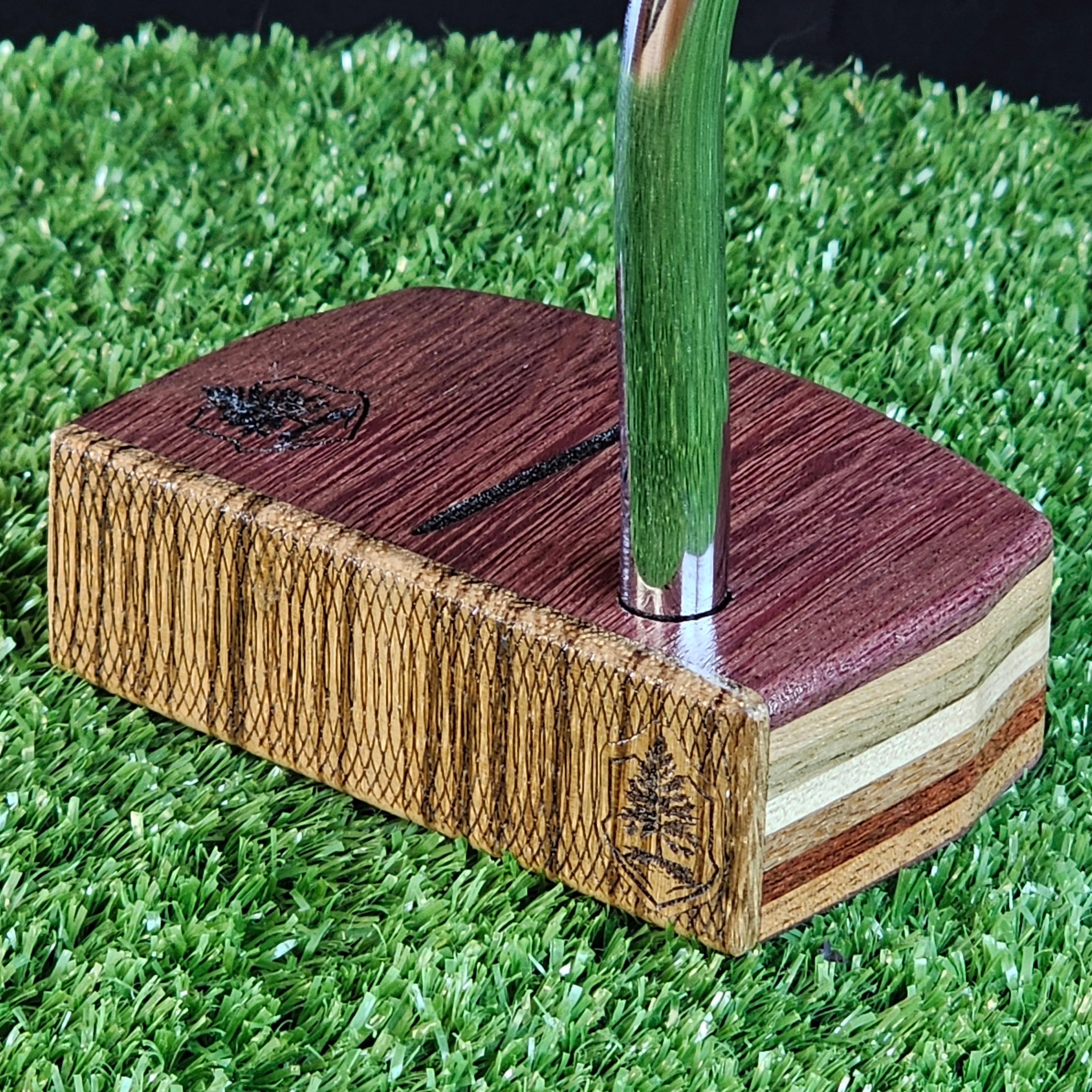 Purpleheart and Zebrawood putter with many exotic wood layers