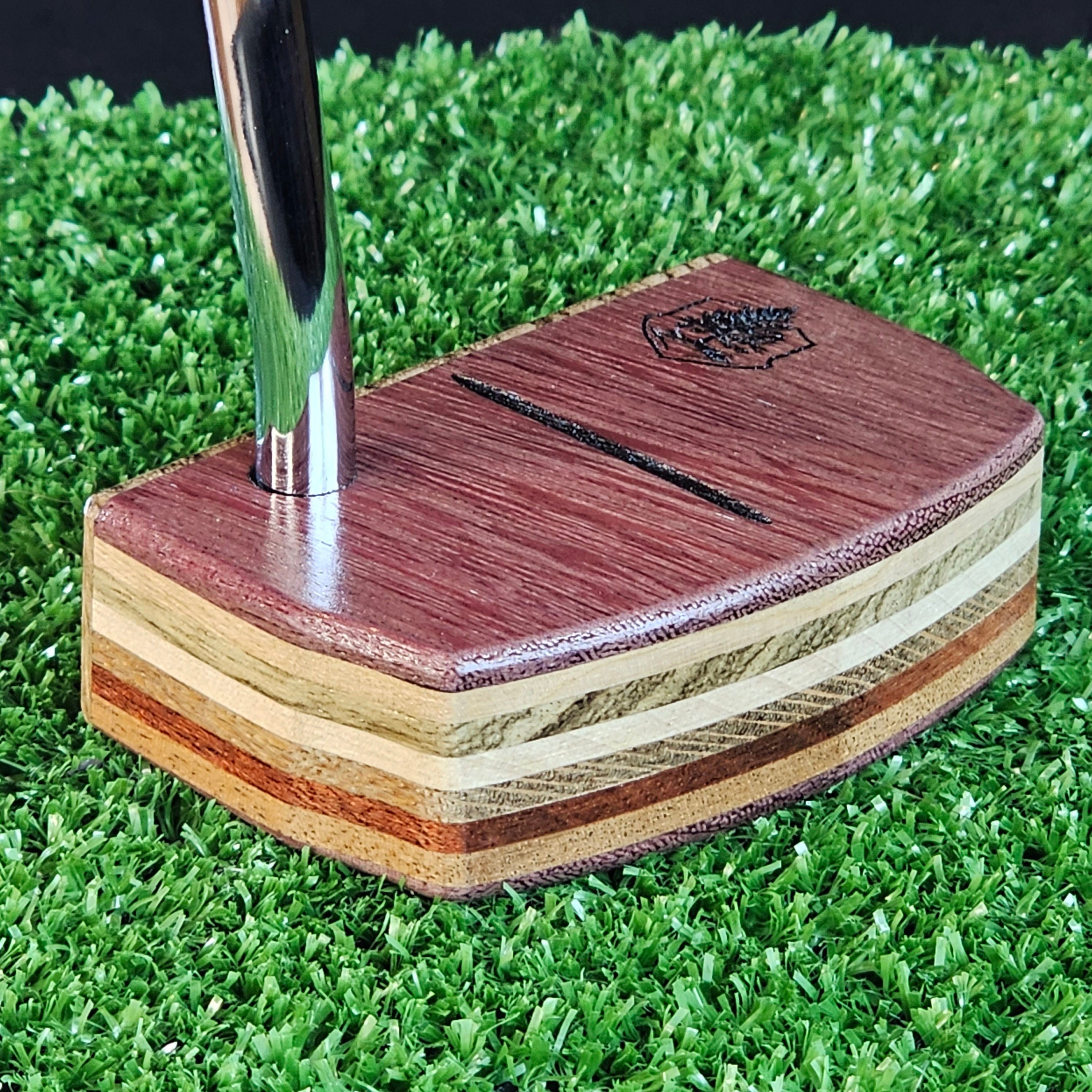 Purpleheart and Zebrawood putter with many exotic wood layers