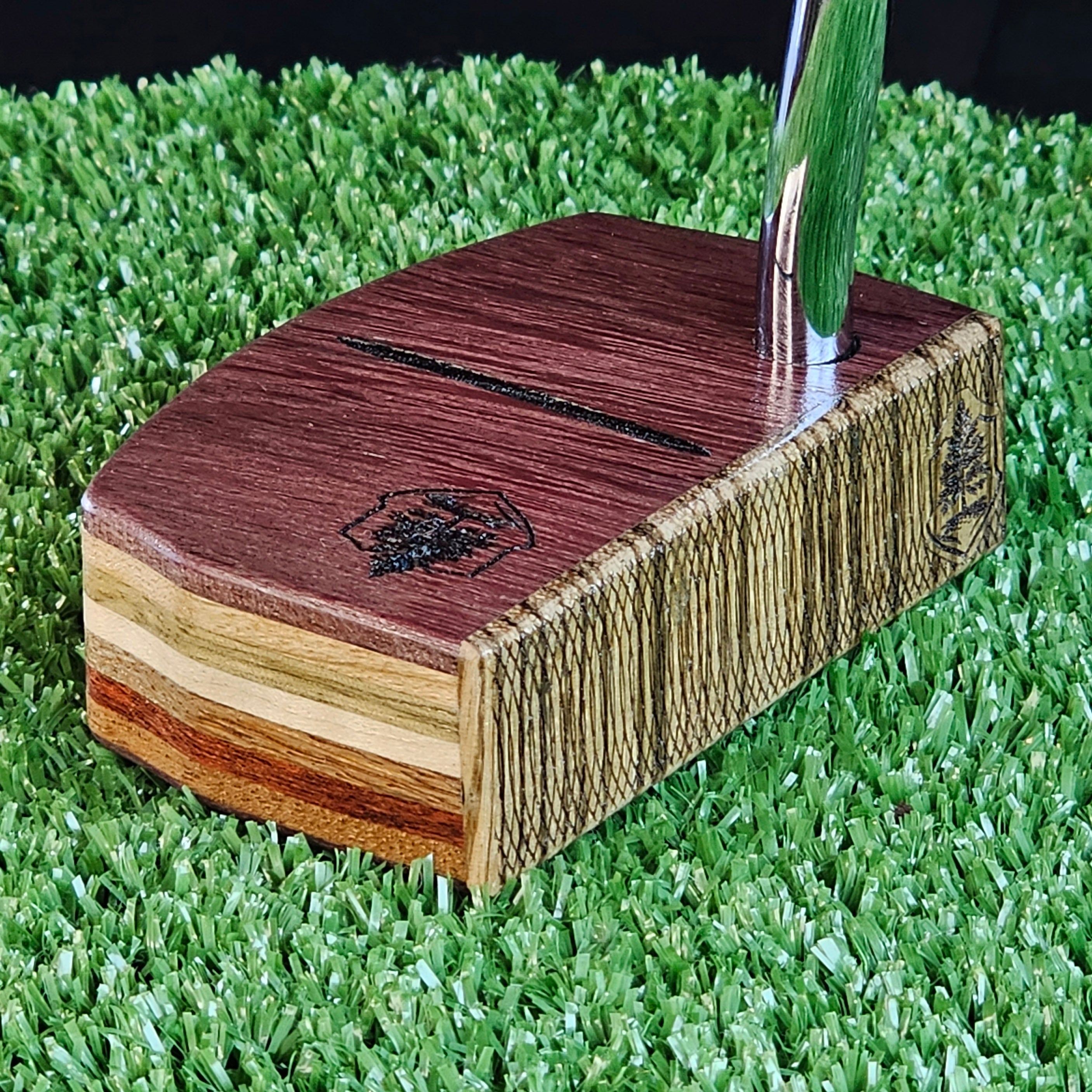 Purpleheart and Zebrawood putter with many exotic wood layers