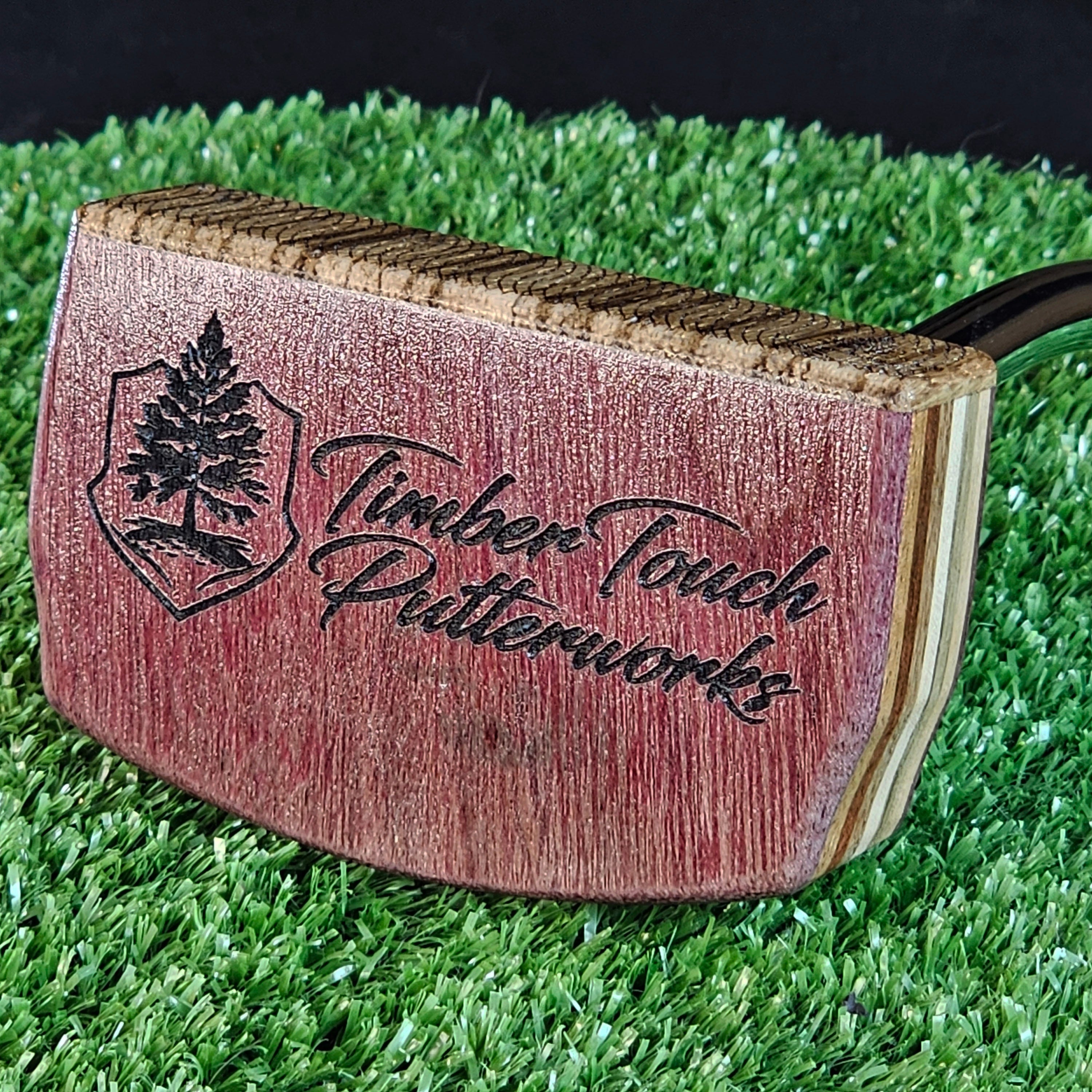 Purpleheart and Zebrawood putter with many exotic wood layers