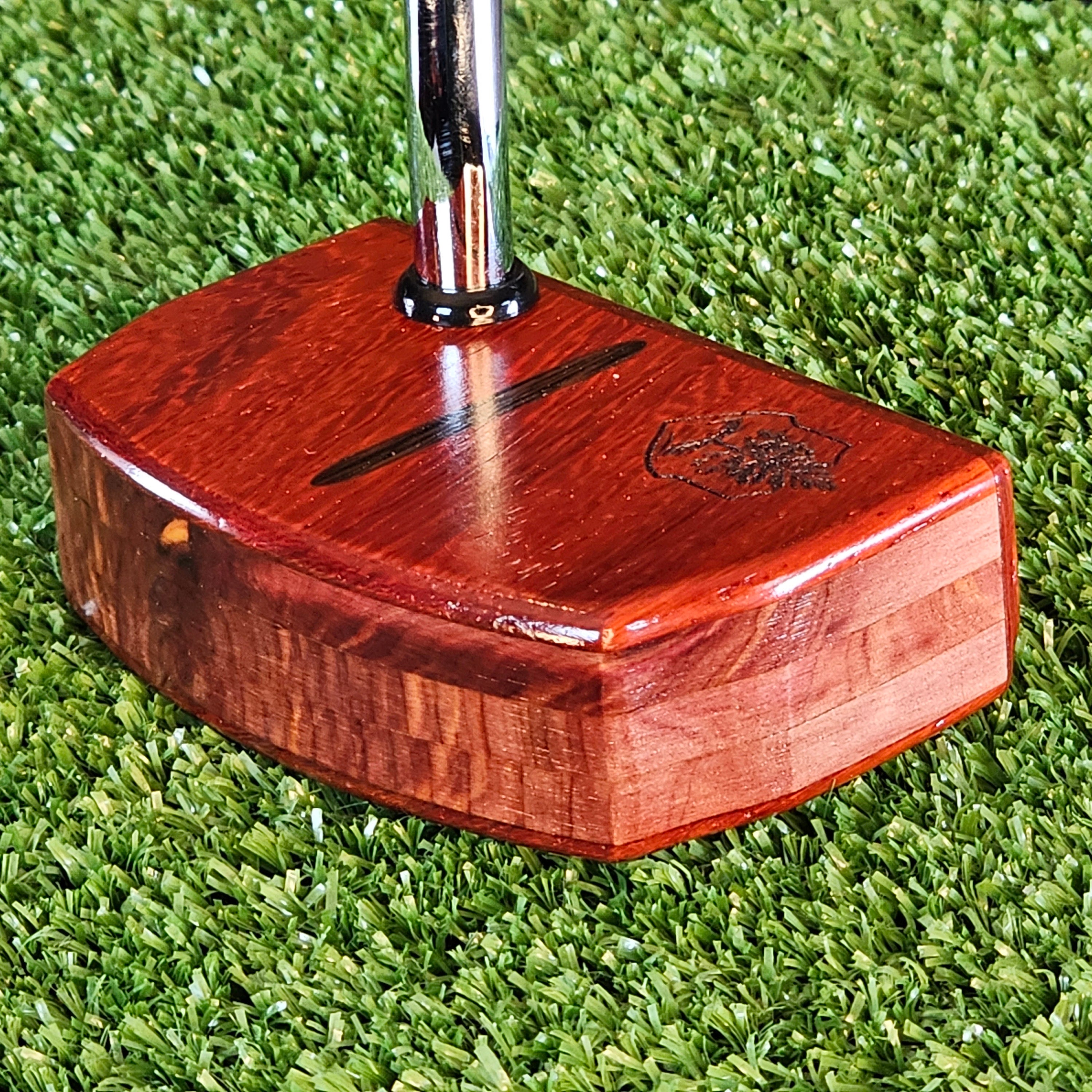 Padauk wood putter with red cedar body and Wenge inlay