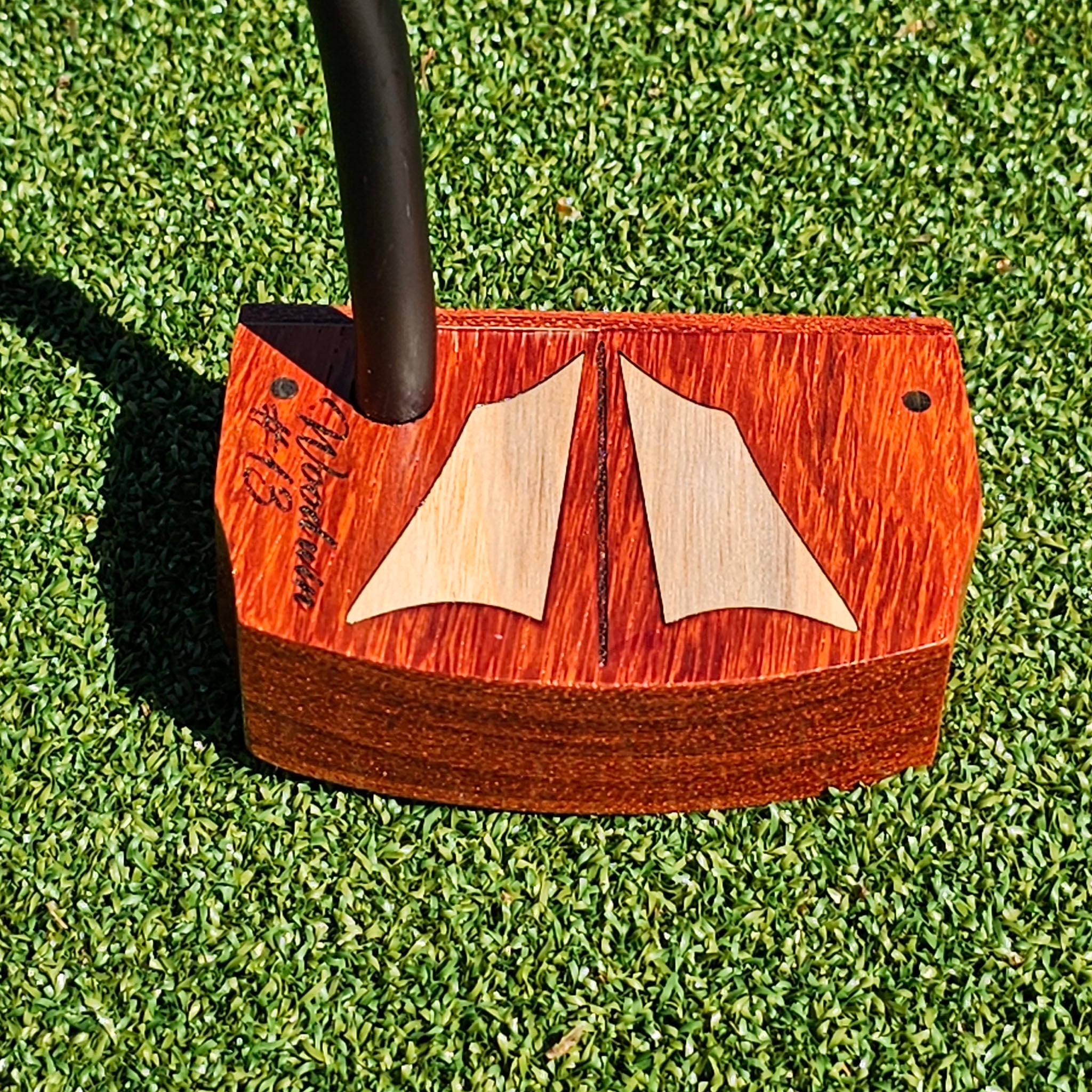 Prototype Padauk wood body putter with Maple inlays