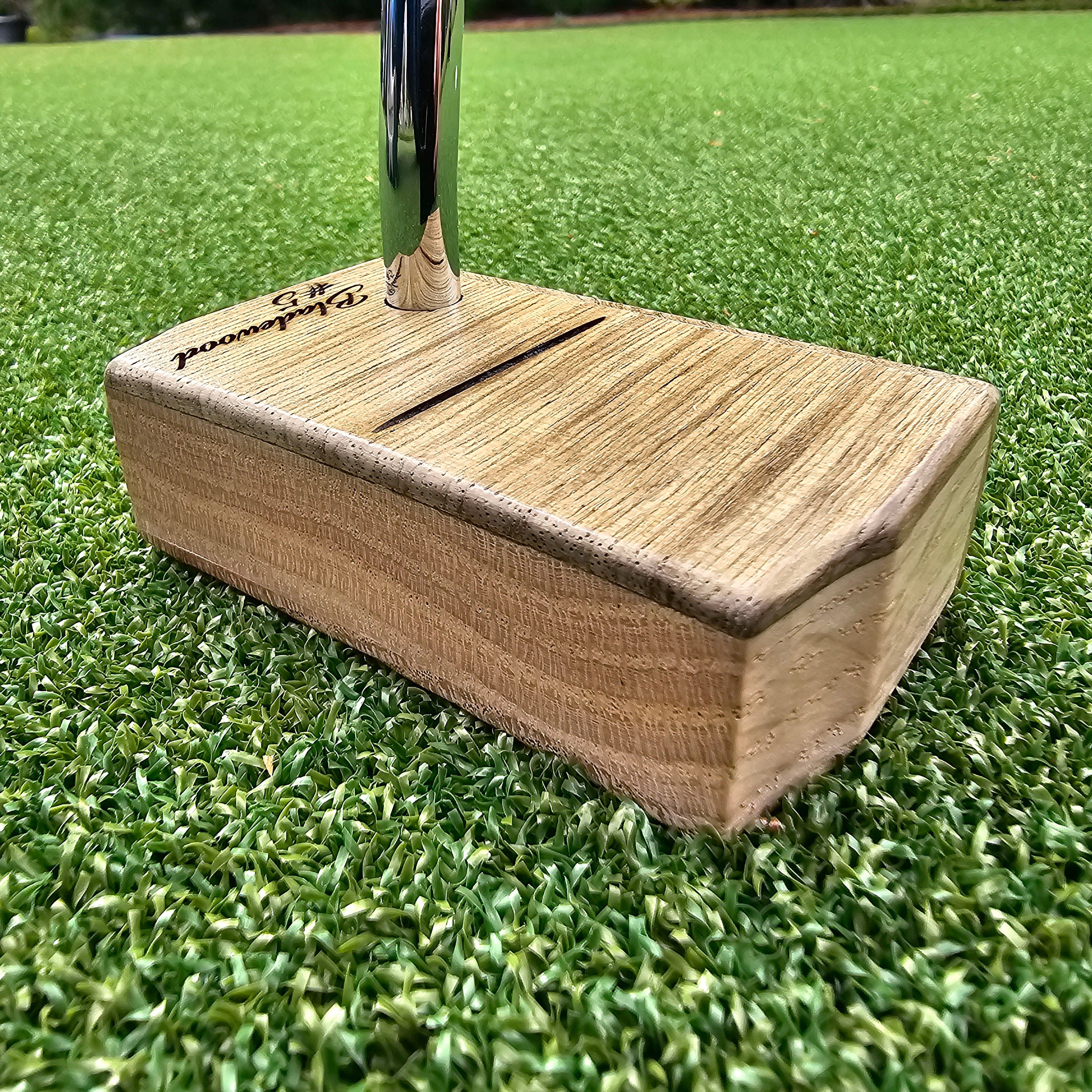 Black Limba wood top and face putter with Hard Oak Body