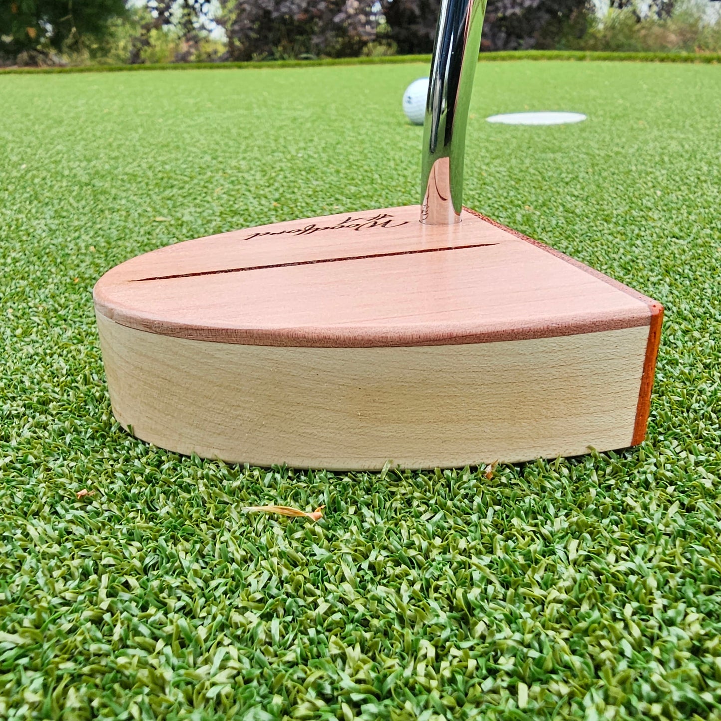 Curly Maple Body, Red Cedar top plate putter with Padauk Face plate