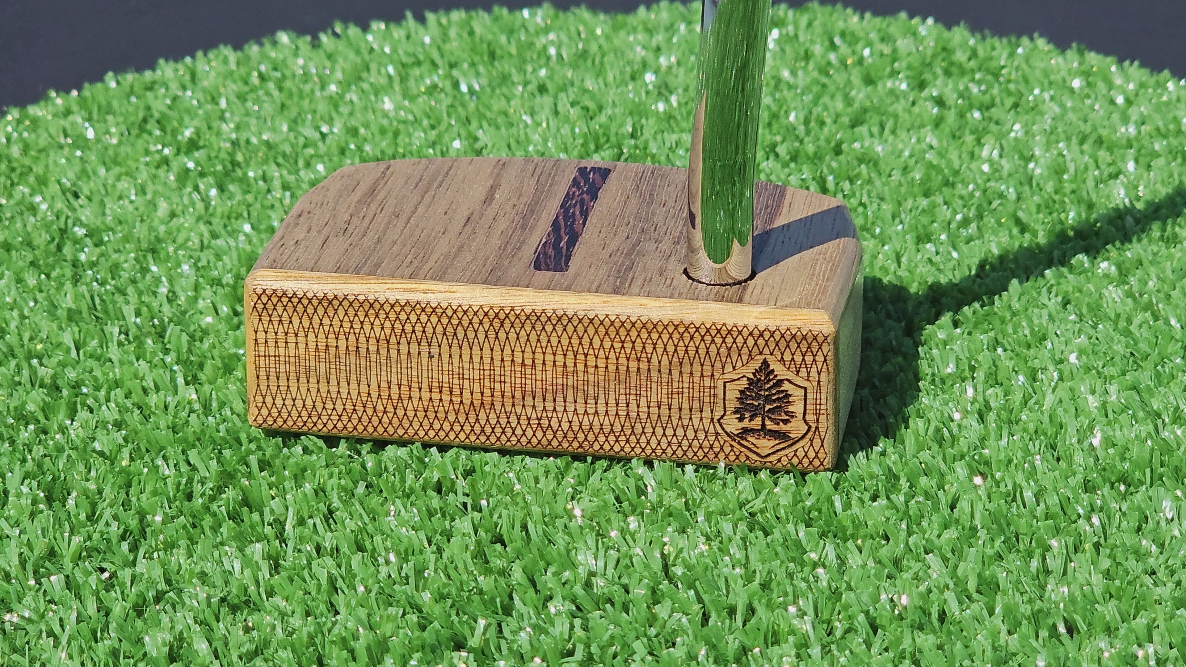 Black Limba and Hard Red Oak putter with clean line top alignment feature