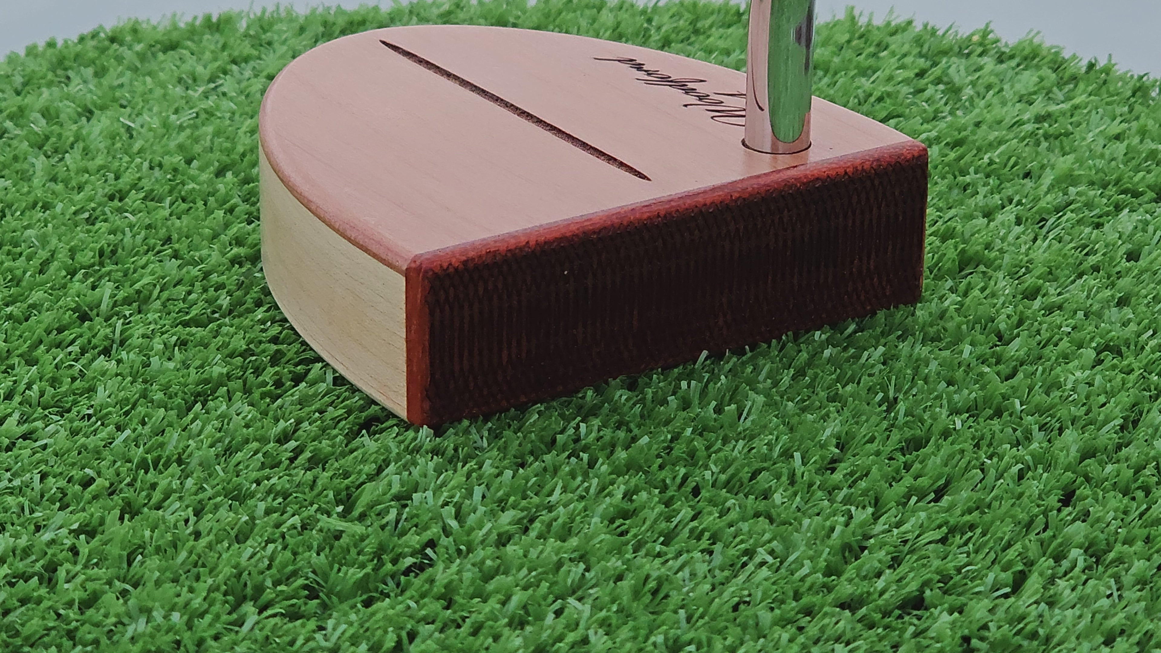 Curly Maple Body, Red Cedar top plate putter with Padauk Face plate