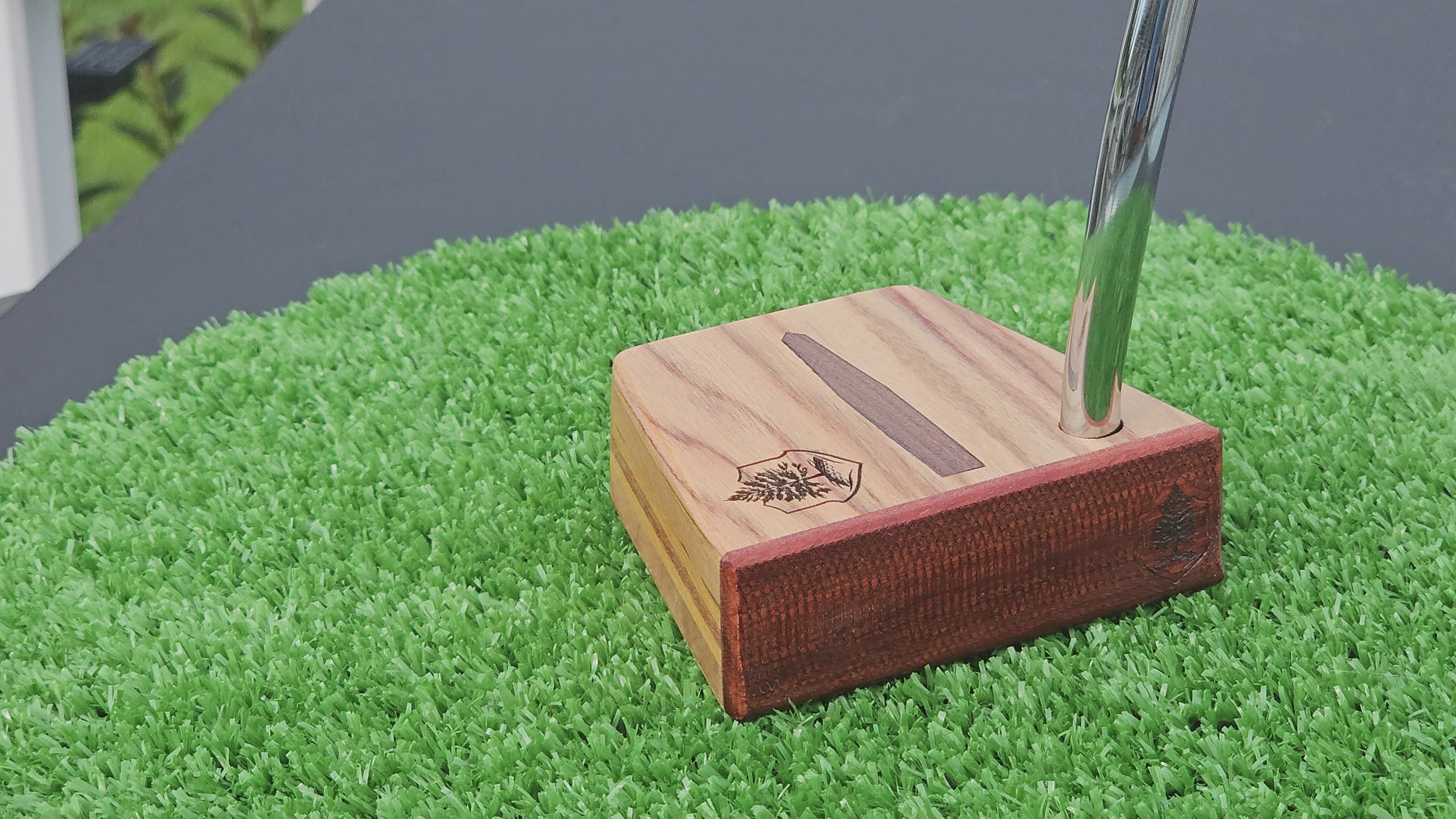 Canarywood and cedar layered putter with Paduak wood faceplate