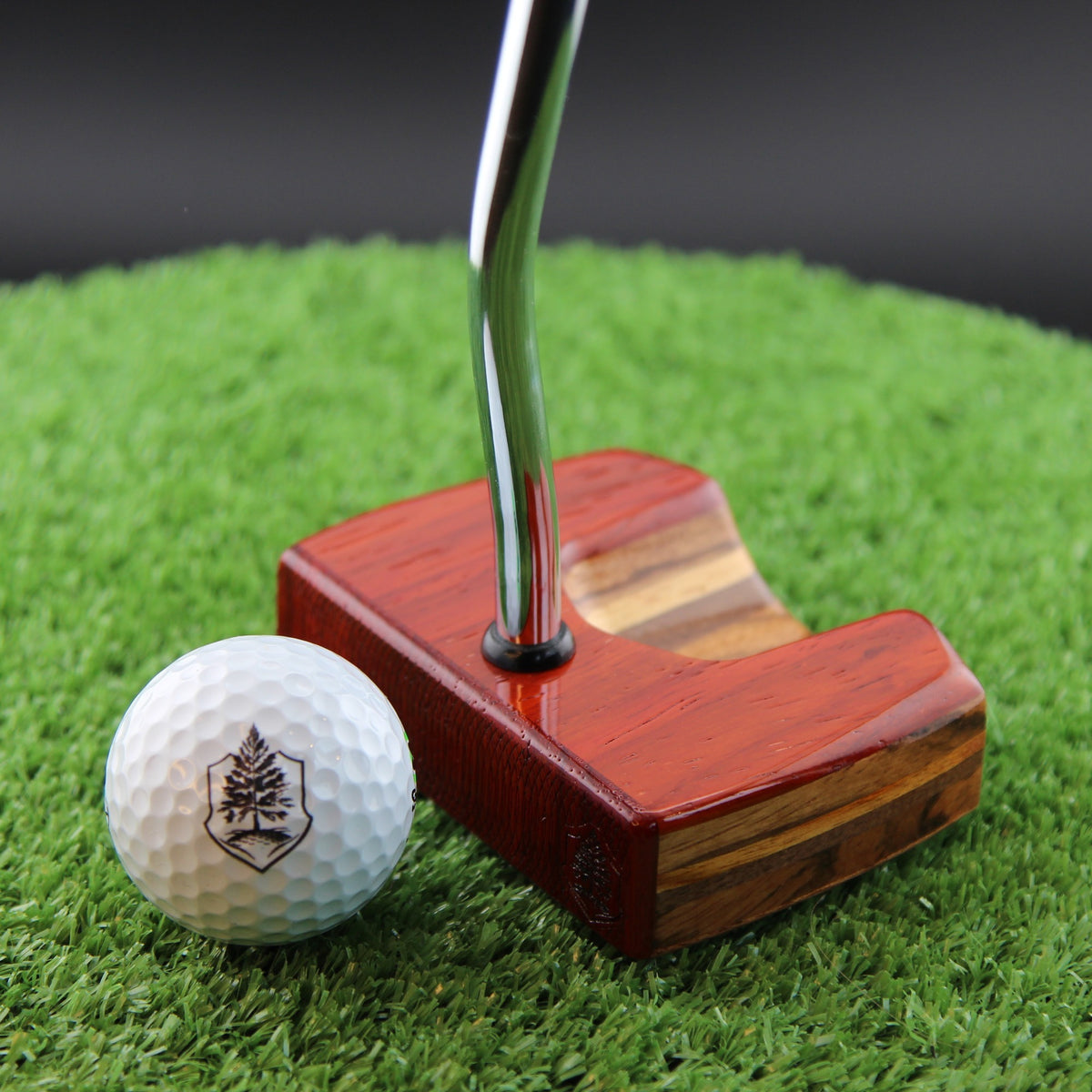 TimberTouch Bandolier Putter Woodrich Regal wood putter, Padauk and Zebrawood, zero torque center shaft – face view with golf ball